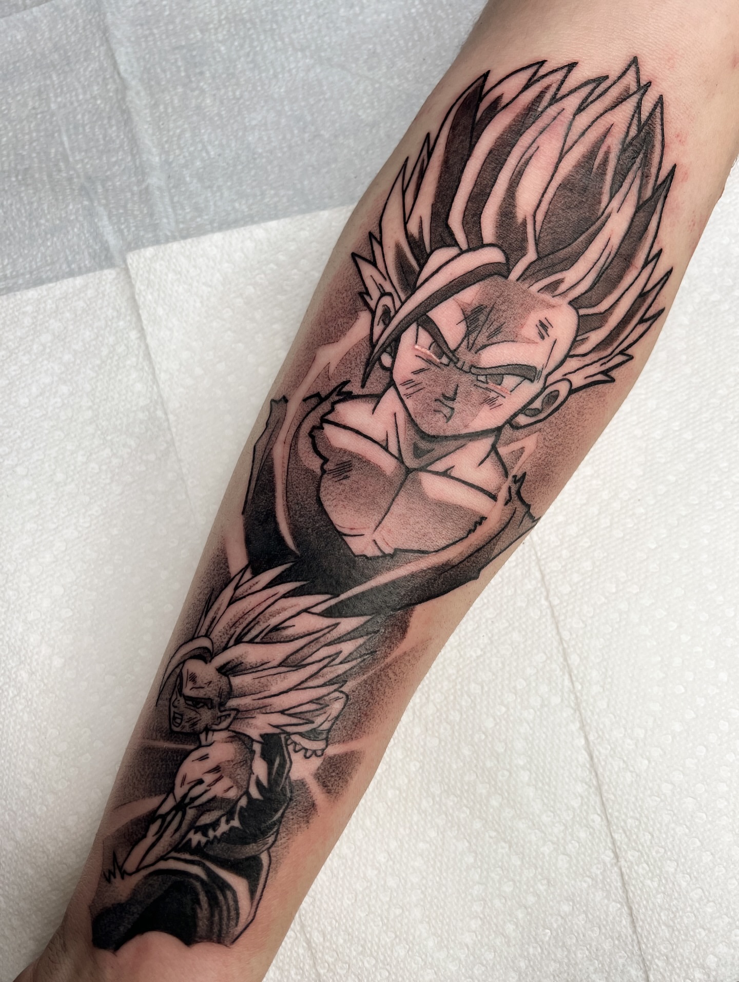 Super saiyan anime tattoo on the forearm by Nathan Garcia