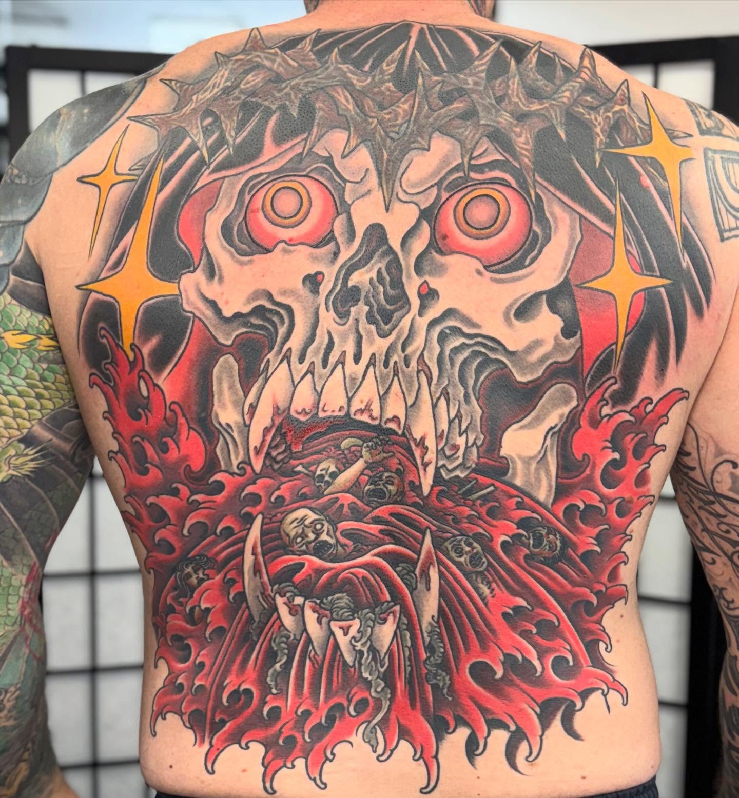 Hellish skull dark realism tattoo on the back by Matthew Tillman