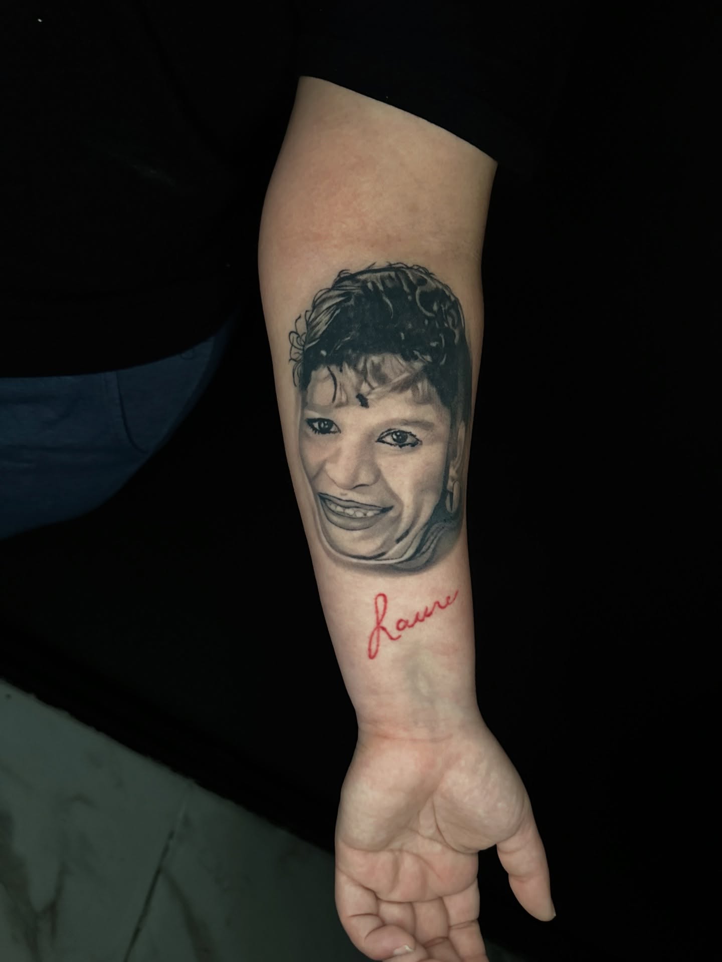 Portrait realism tattoo on the forearm by Goga