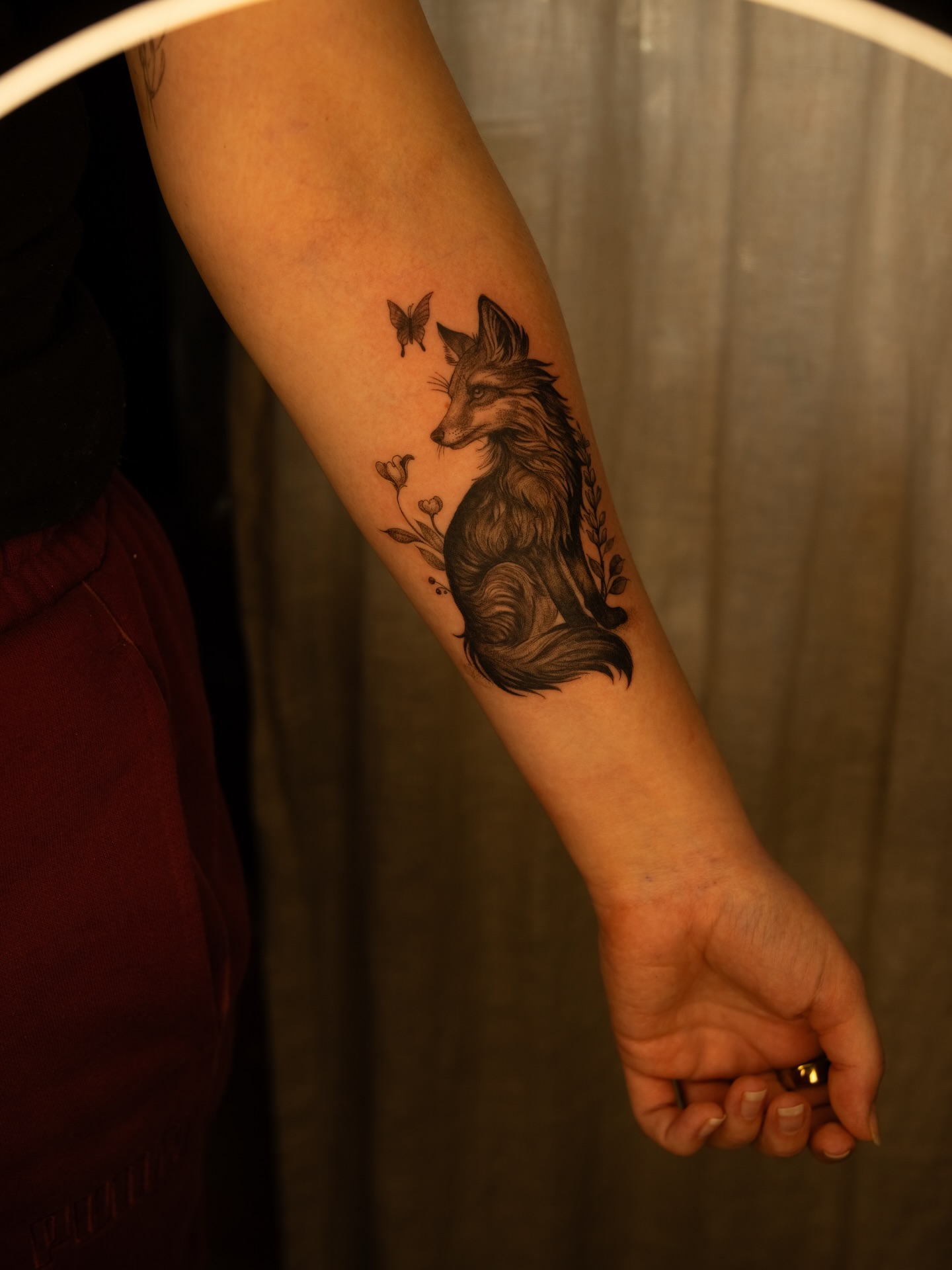 Fox and butterfly realism tattoo on the forearm by Brad Simmons