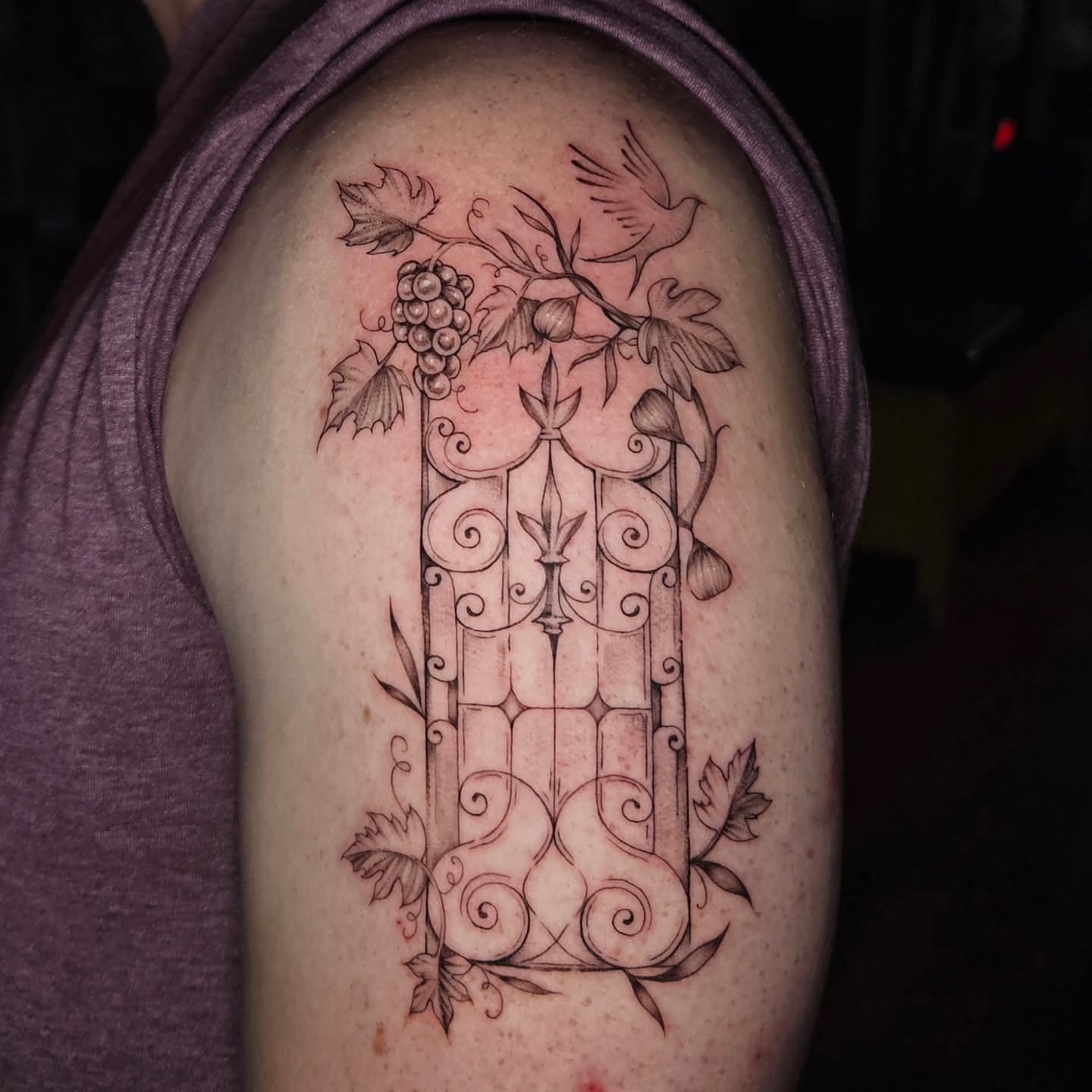Gate with grapevine ornamental tattoo on the shoulder by Courtlyn Bliss