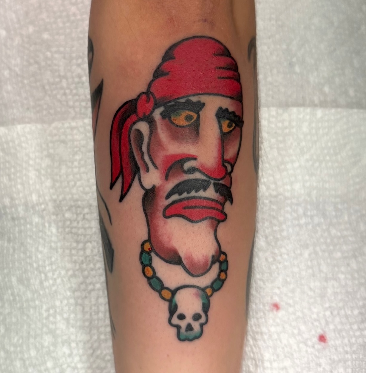 Pirate head American traditional tattoo on the forearm by Buddy (Holiday) Orr, Las Vegas, Nevada