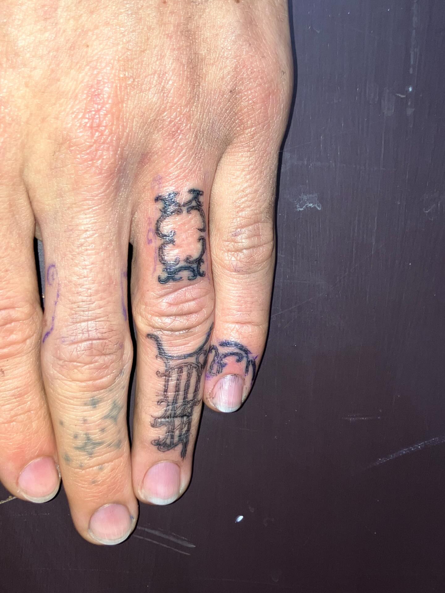 Roman numerals black and grey tattoo on the hand by Sashka