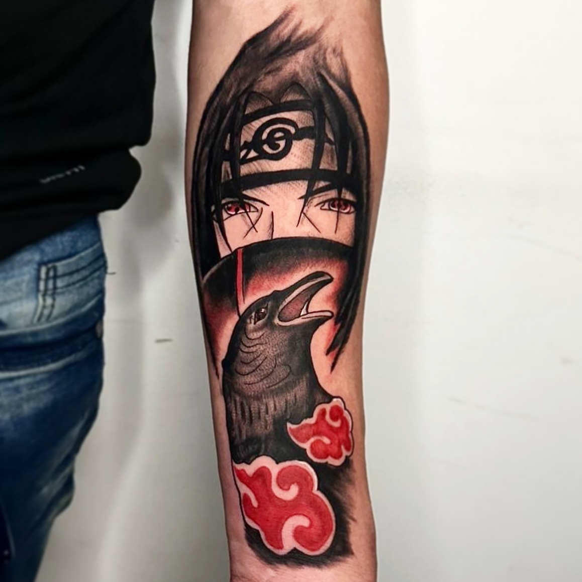 Anime character with crow anime tattoo on the forearm by Messias Tattoo Artist