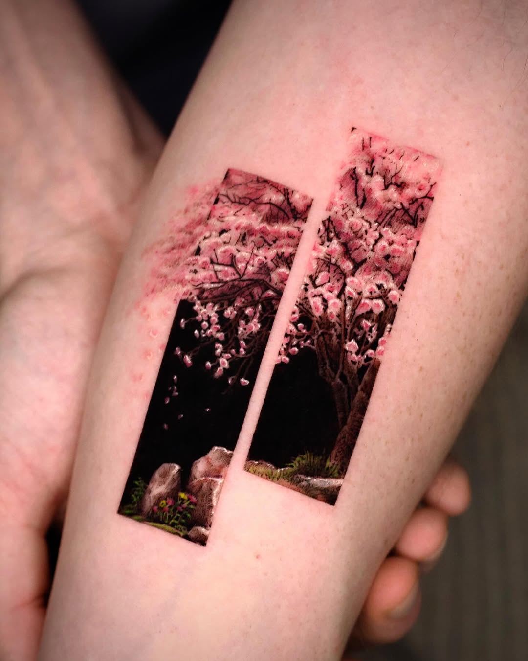 Cherry blossom trees and rocks watercolor tattoo on the forearm by Rizn
