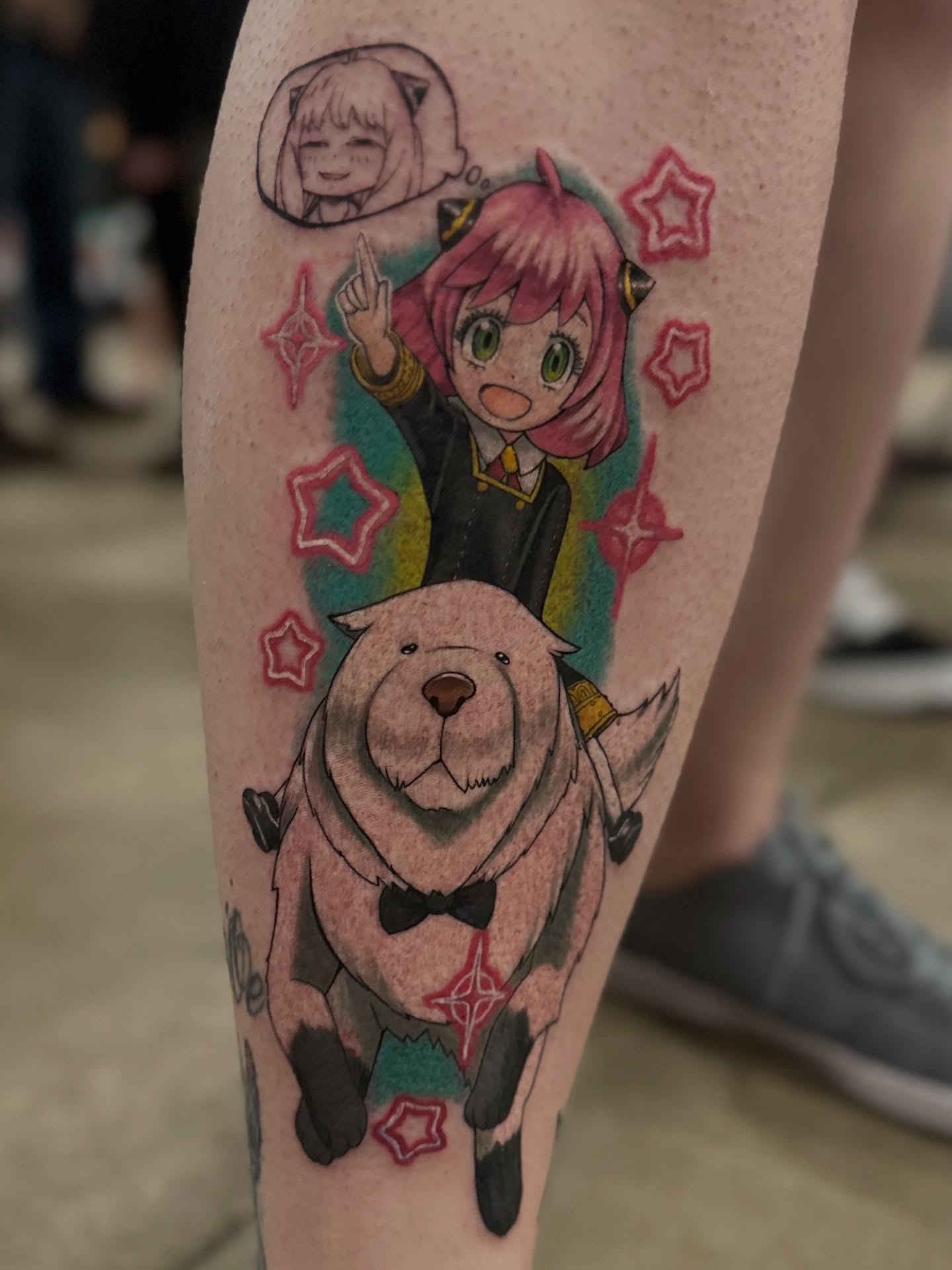 Anime character and dog anime tattoo on the forearm by Toni🌊