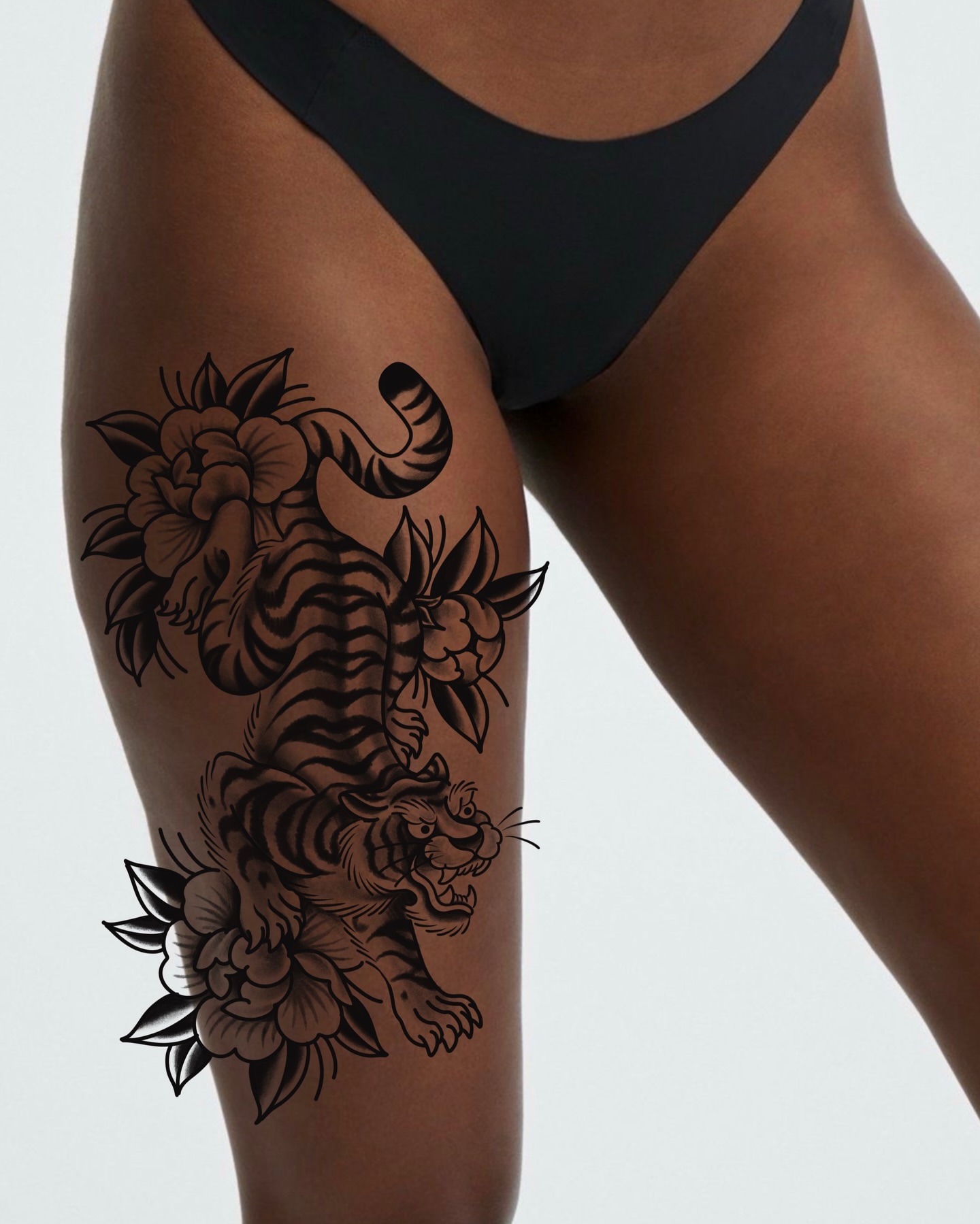 Tiger and flowers black and grey tattoo on the thigh by Bre Grover, Vancouver, British Columbia