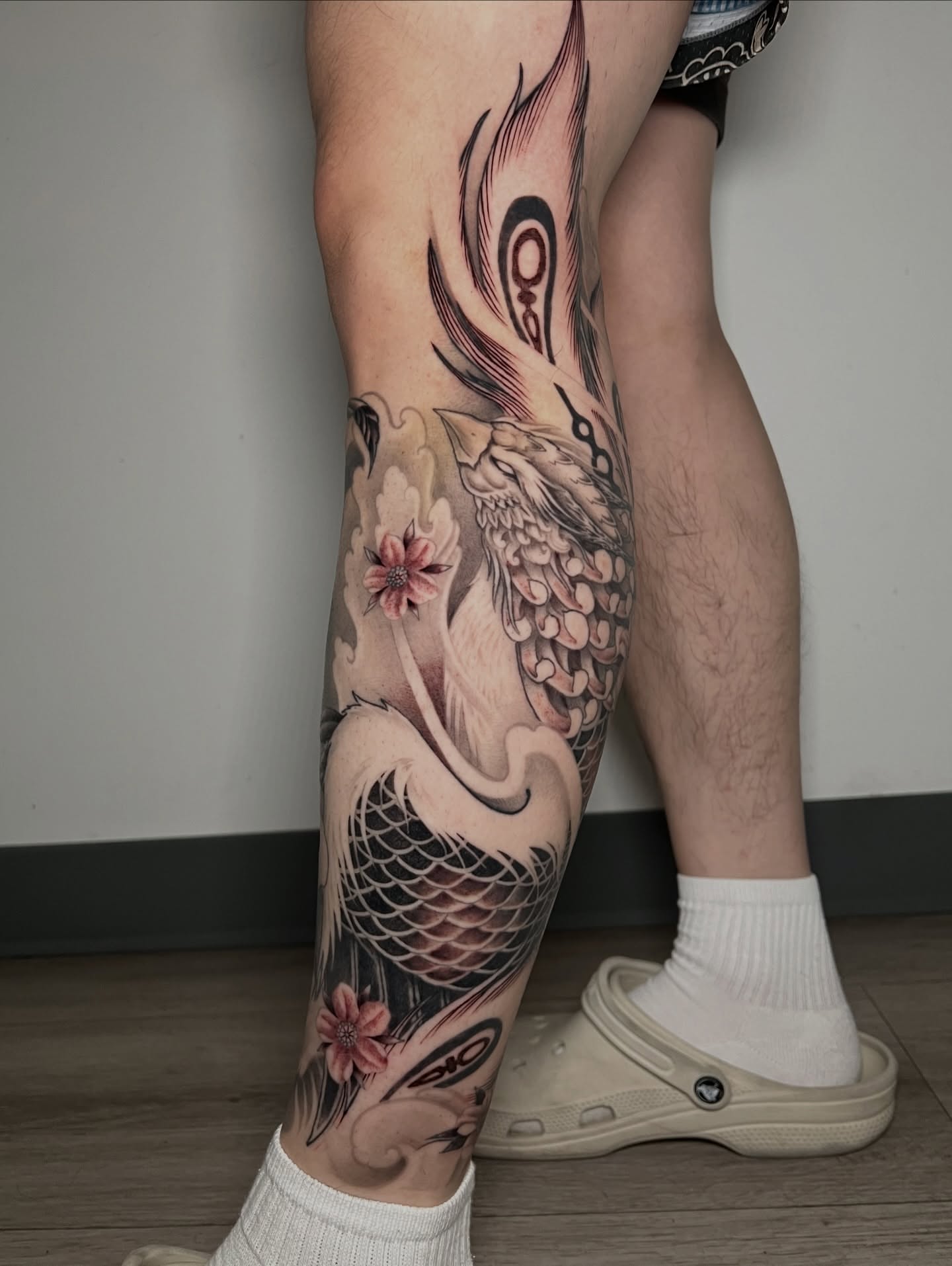 Koi fish and cherry blossoms japanese irezumi tattoo on the calf by Johnson