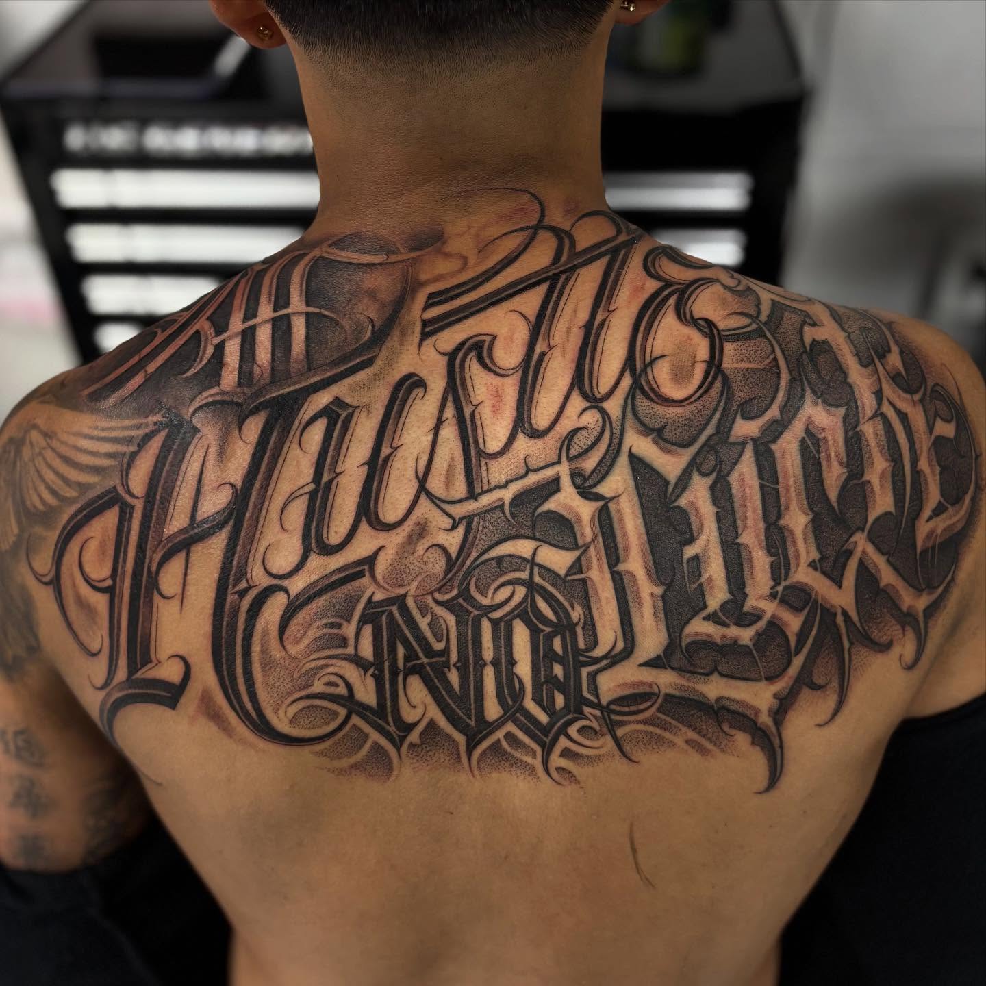 Script lettering lettering script tattoo on the back by Ashley brown, Las Vegas, Nevada