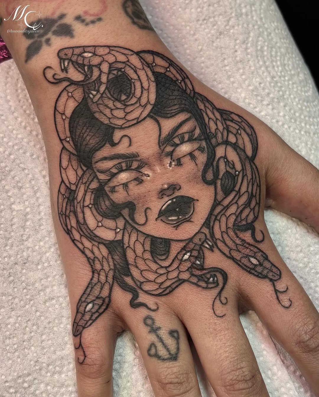Medusa with snakes realism tattoo on the hand by Shanell Snellbaker