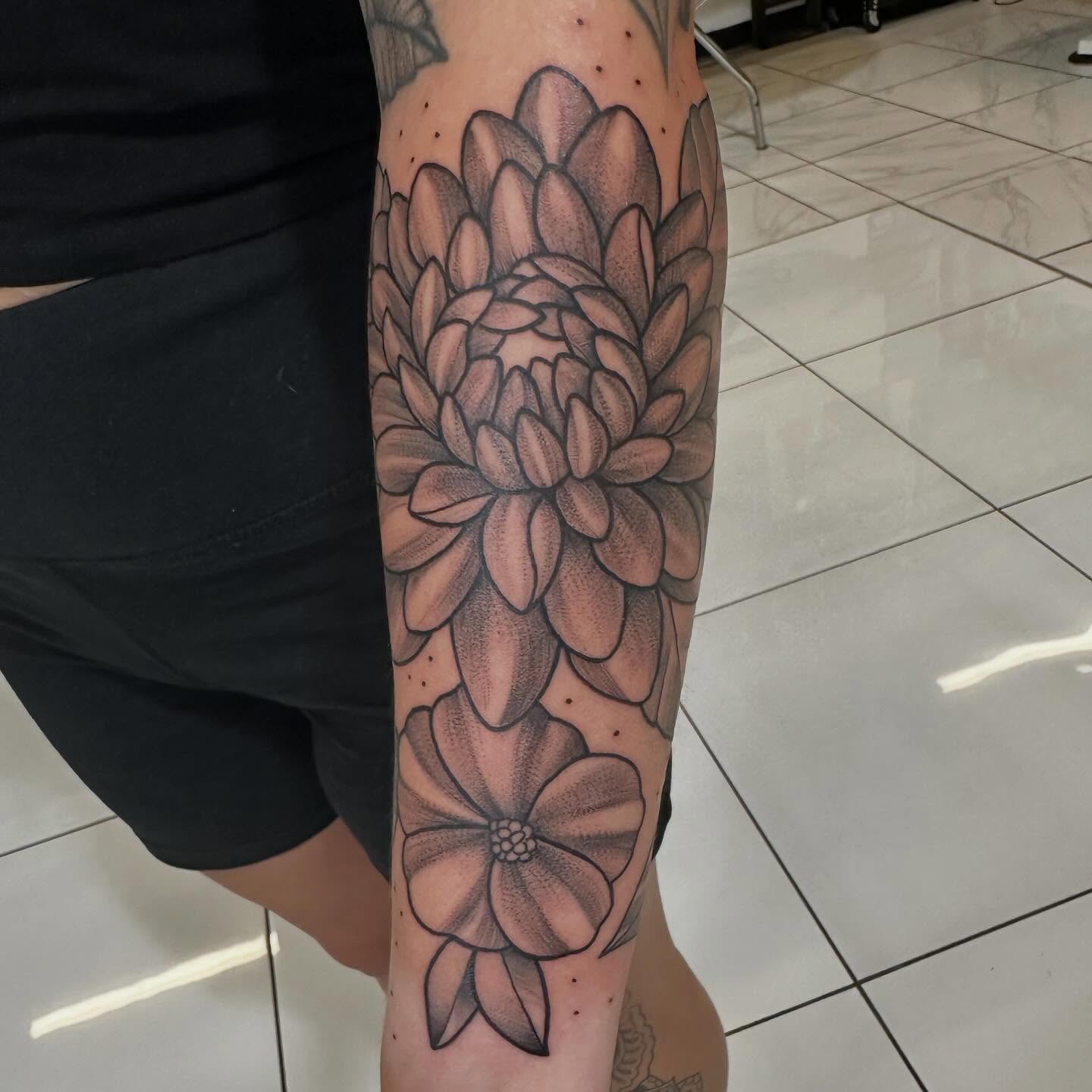 Chrysanthemum dotwork tattoo on the forearm by Raul Najera Tattoo, Plano, Texas
