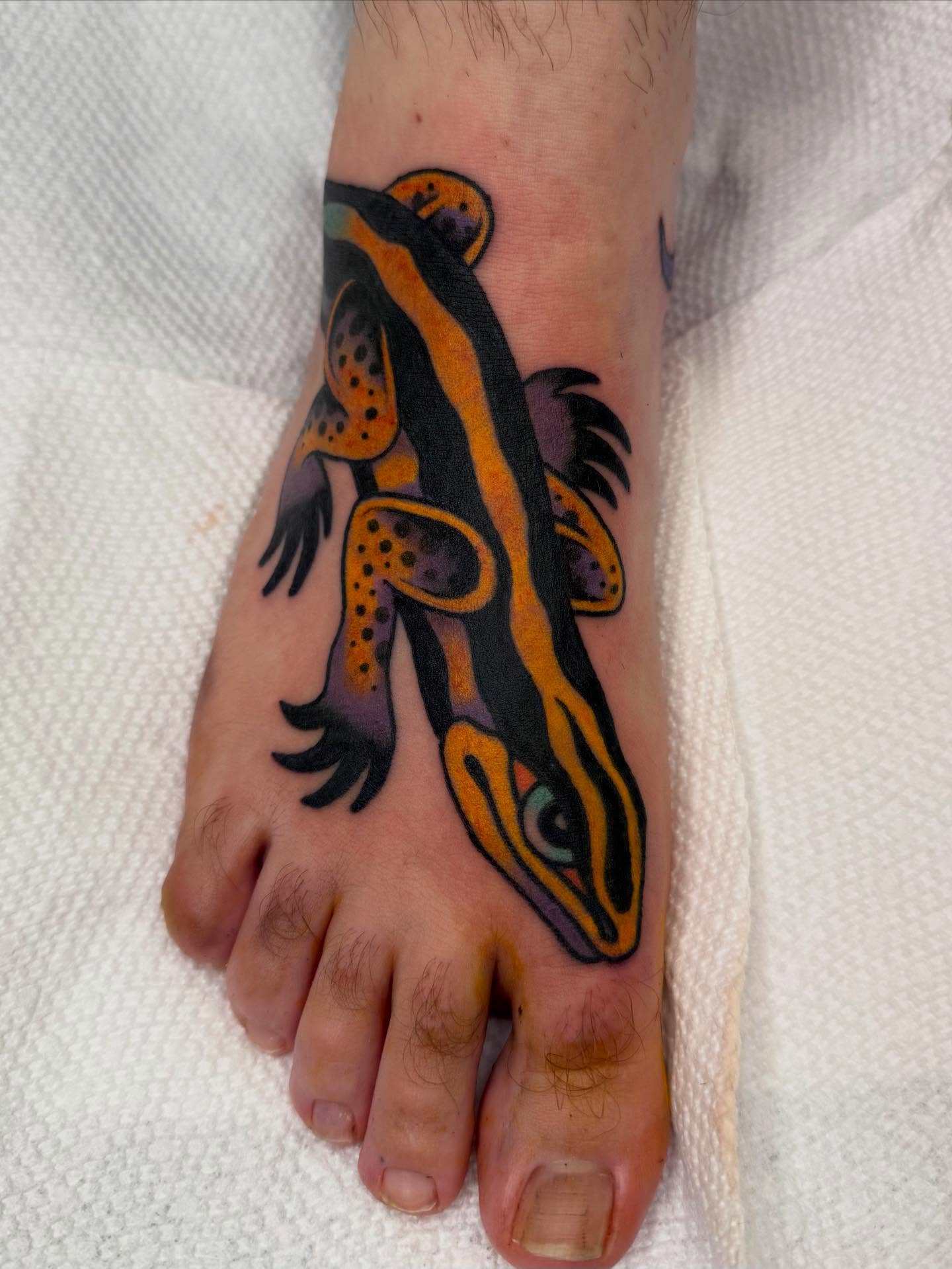 Gecko American traditional tattoo on the foot by Emma Eaton