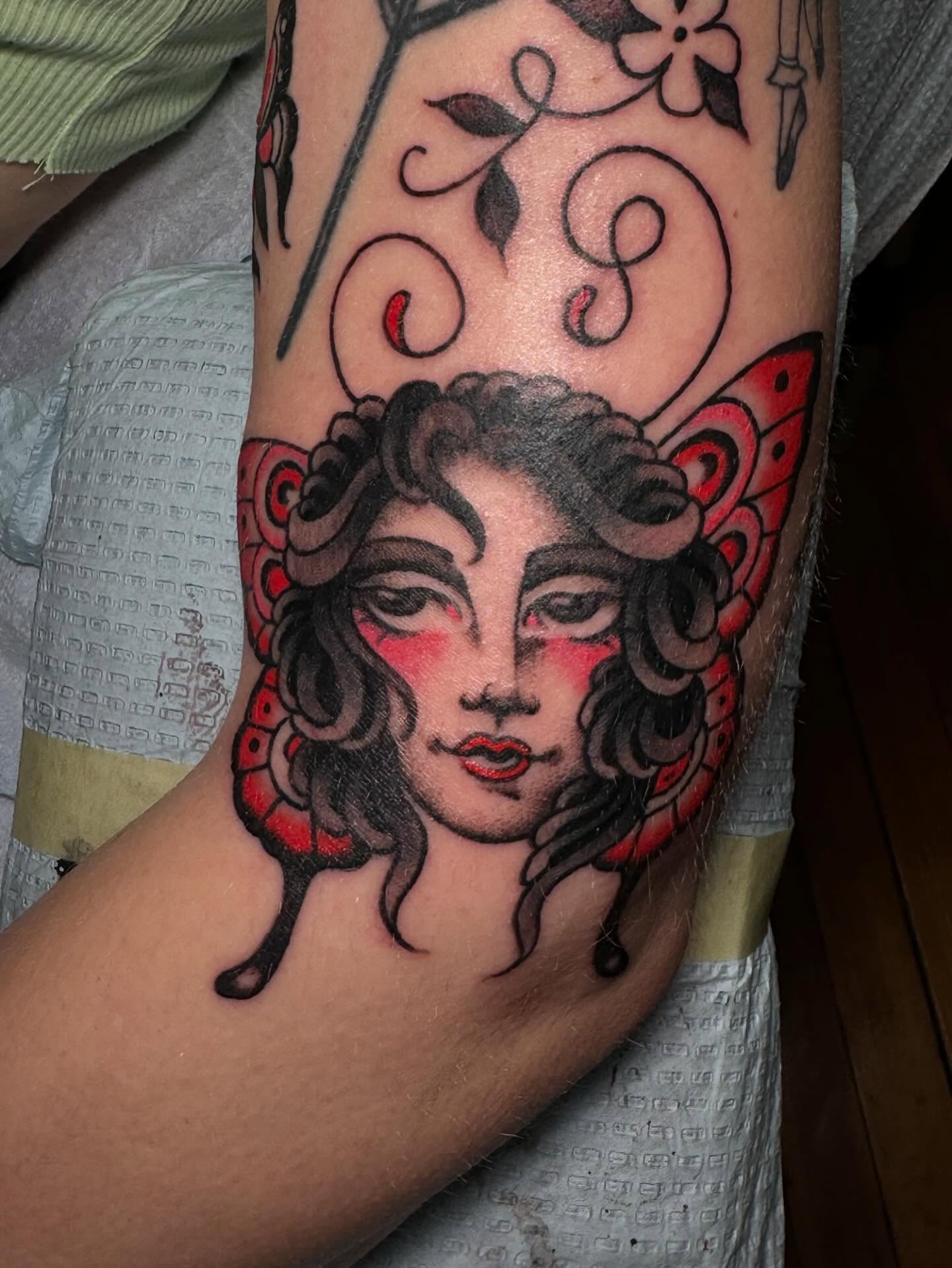 Woman with butterfly wings American traditional tattoo on the forearm by B