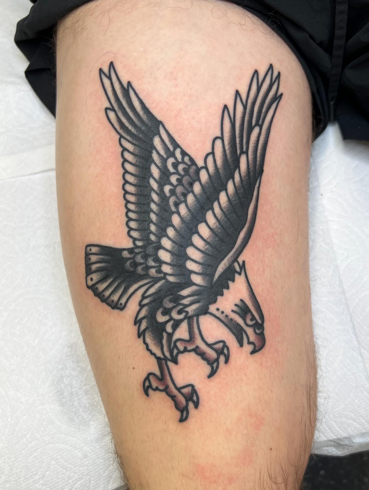 Eagle black and grey tattoo on the thigh by Tattoo