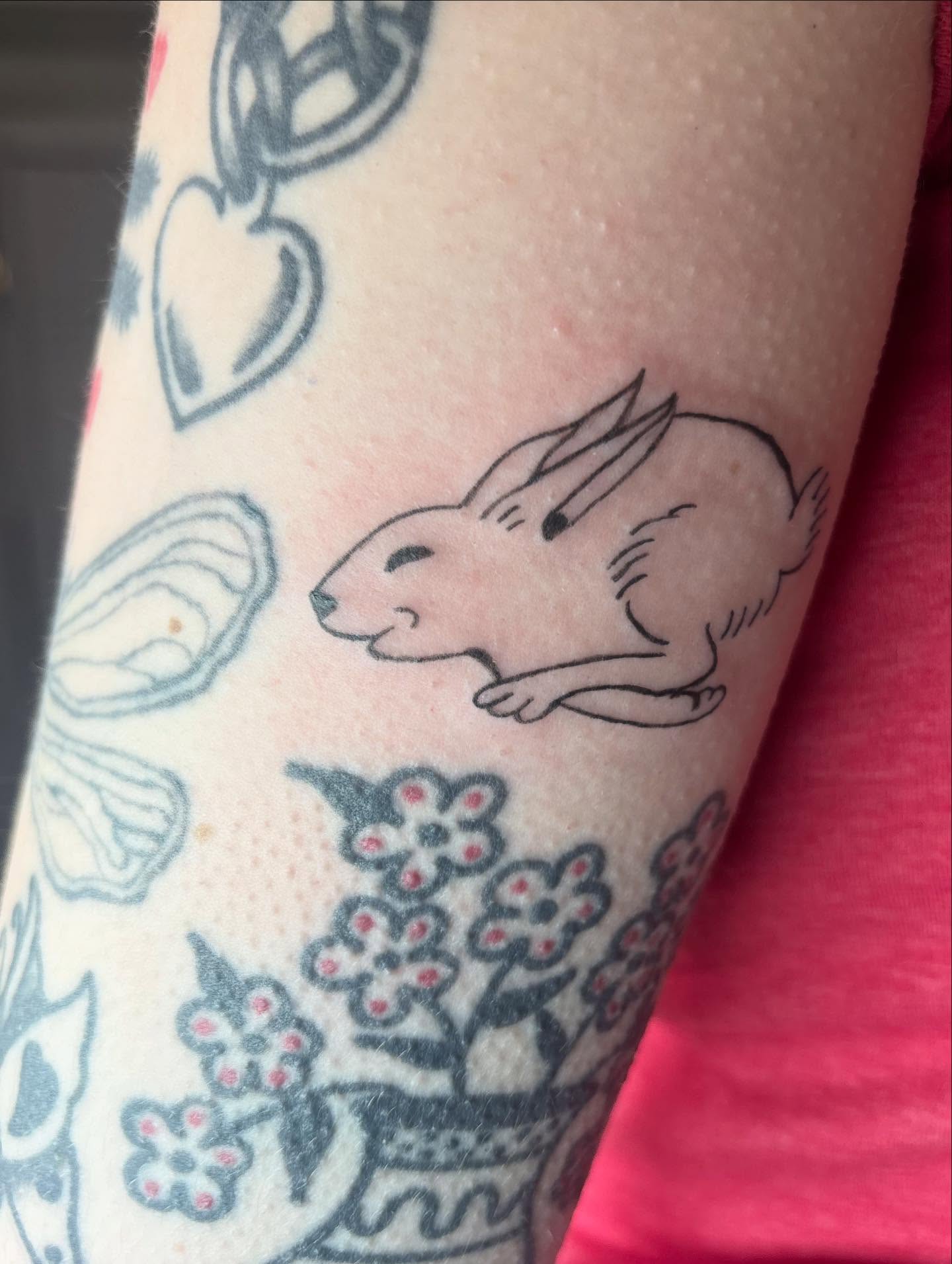 Rabbit minimalist tattoo on the forearm by Mickey