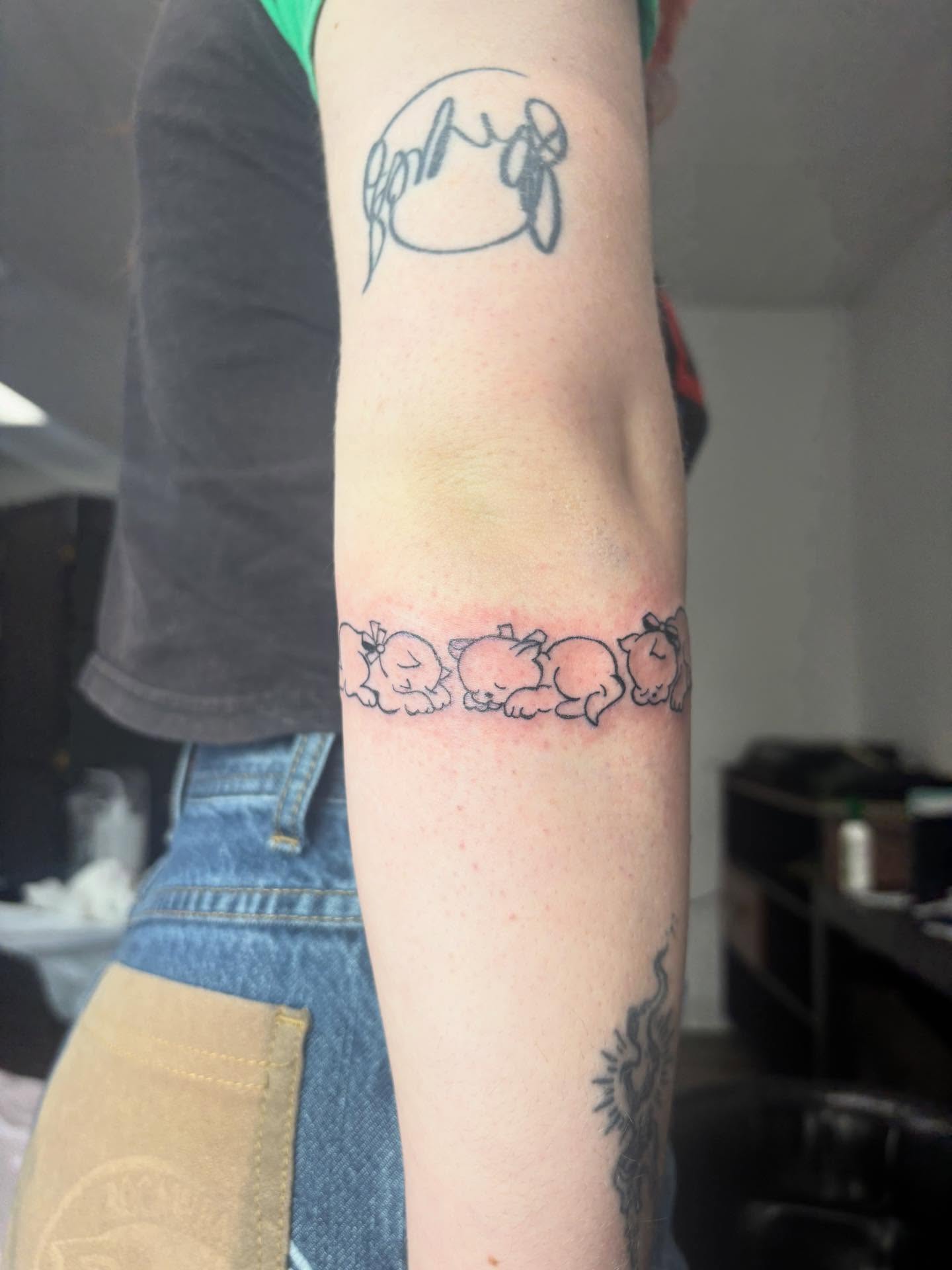 Piglets dotwork tattoo on the forearm by Mickey