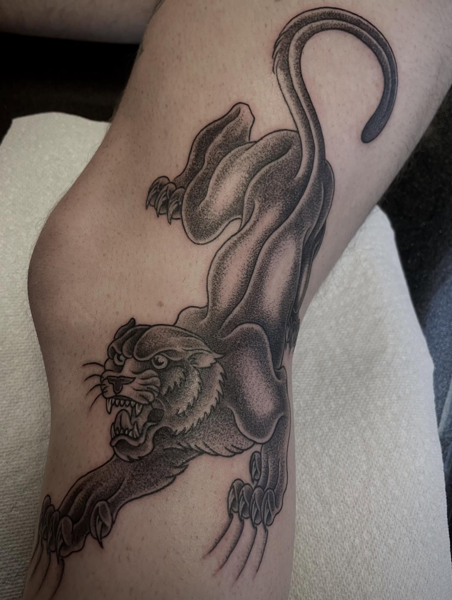 Panther black and grey tattoo on the forearm by Micheal McGlinchey