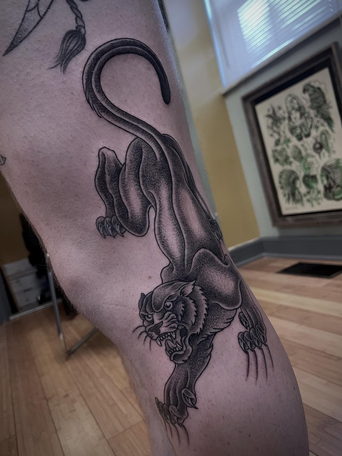 Panther black and grey tattoo on the forearm by Micheal McGlinchey