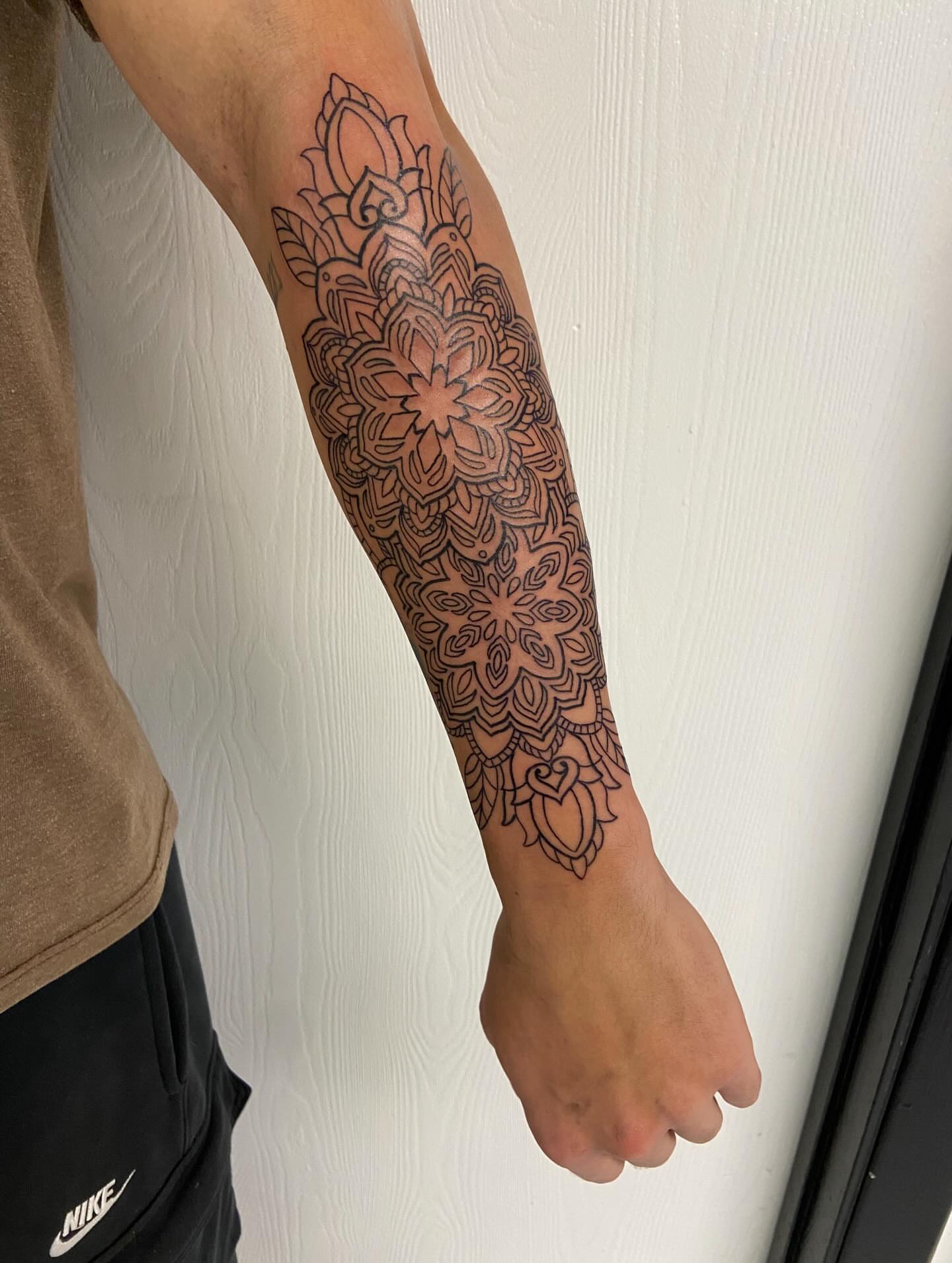 Floral mandala ornamental tattoo on the forearm by Sophia