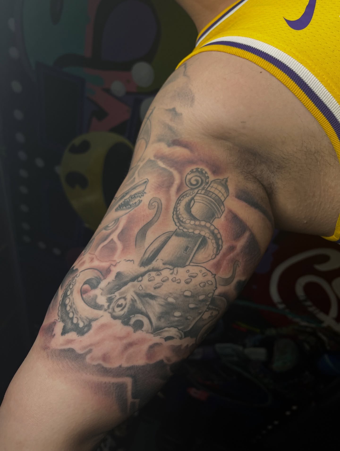Octopus and lighthouse American traditional tattoo on the forearm by Abel Ponce