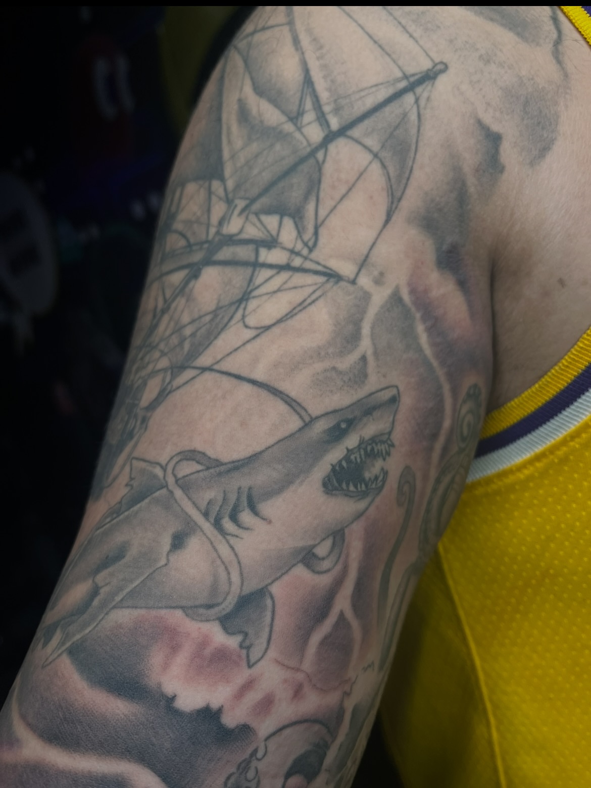 Great white shark realism tattoo on the upper arm by Abel Ponce
