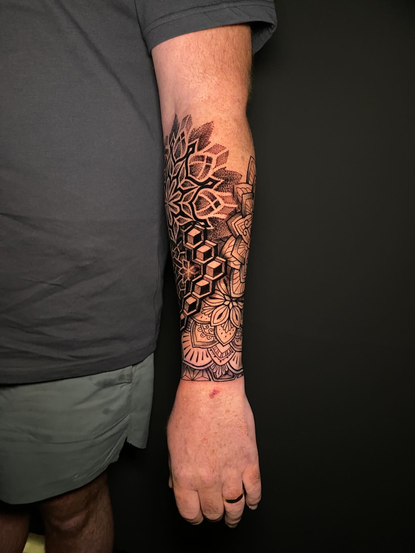 Geometric mandala dotwork tattoo on the forearm by @dom_macio_tattoo