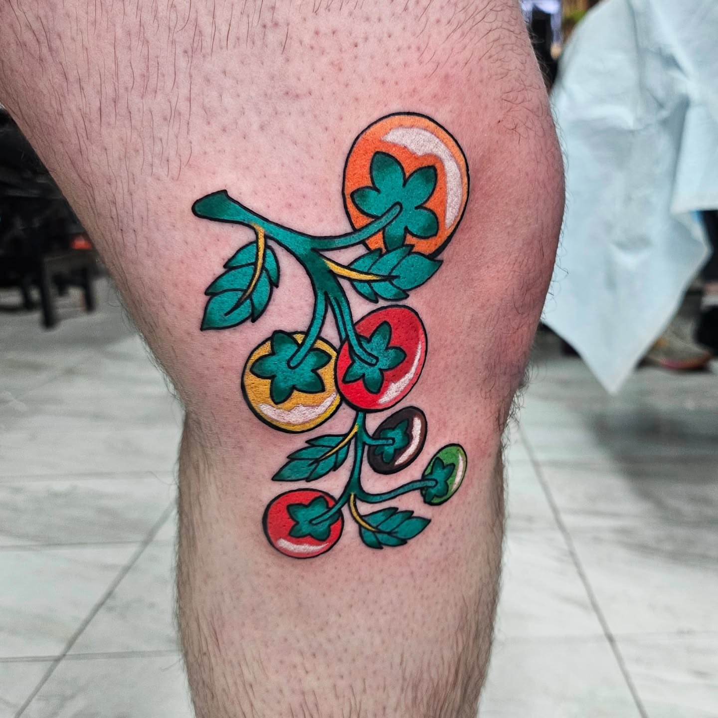 Tomato plant new school tattoo on the thigh by Gray