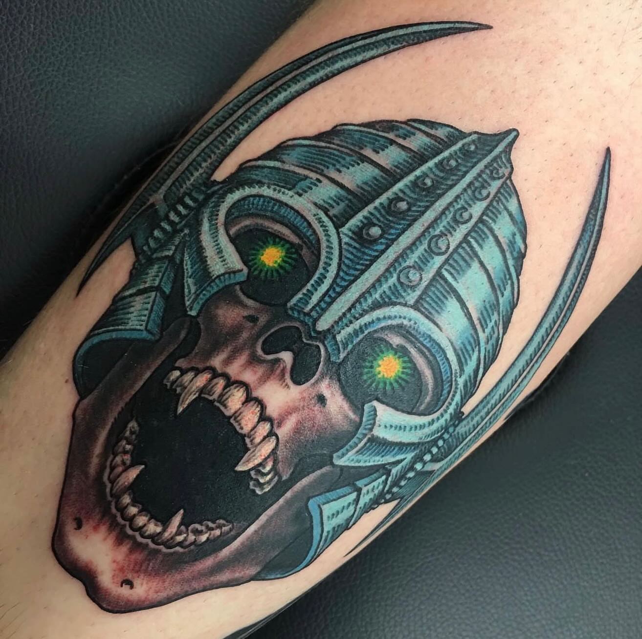 Cyborg skull dark realism tattoo on the forearm by Mike Wilson
