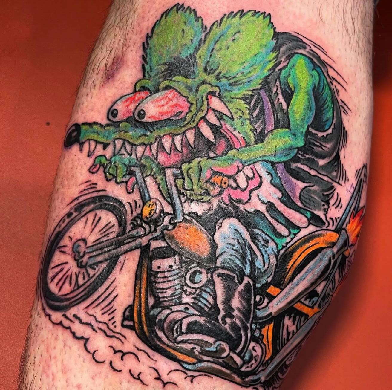 Monster riding motorcycle new school tattoo on the forearm by Mike Wilson