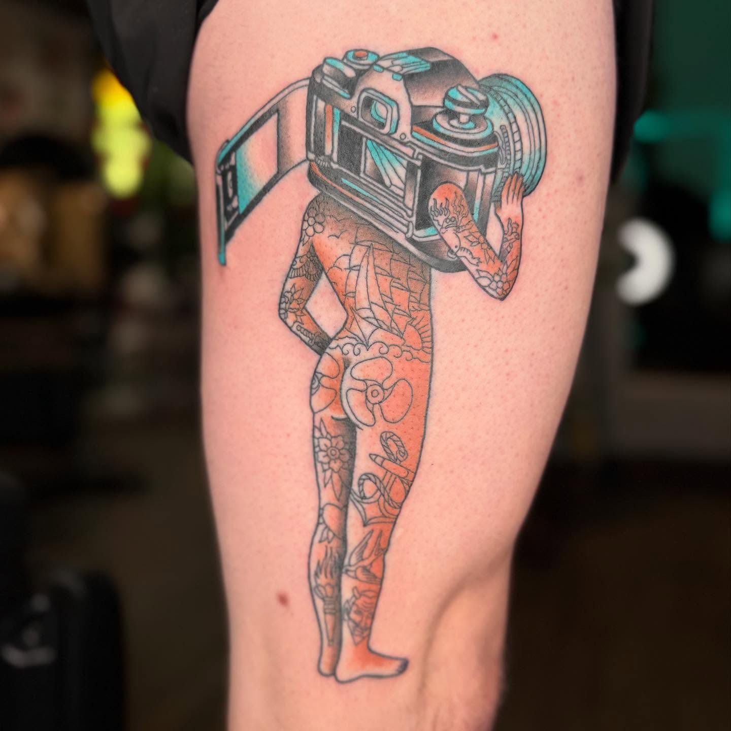 Camera geometric tattoo on the thigh by Curtis Stairs, Seattle, Washington