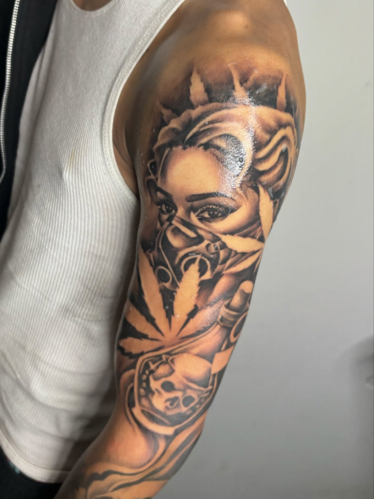 Woman with cannabis leaf realism tattoo on the forearm by FleeDott 🇨🇴