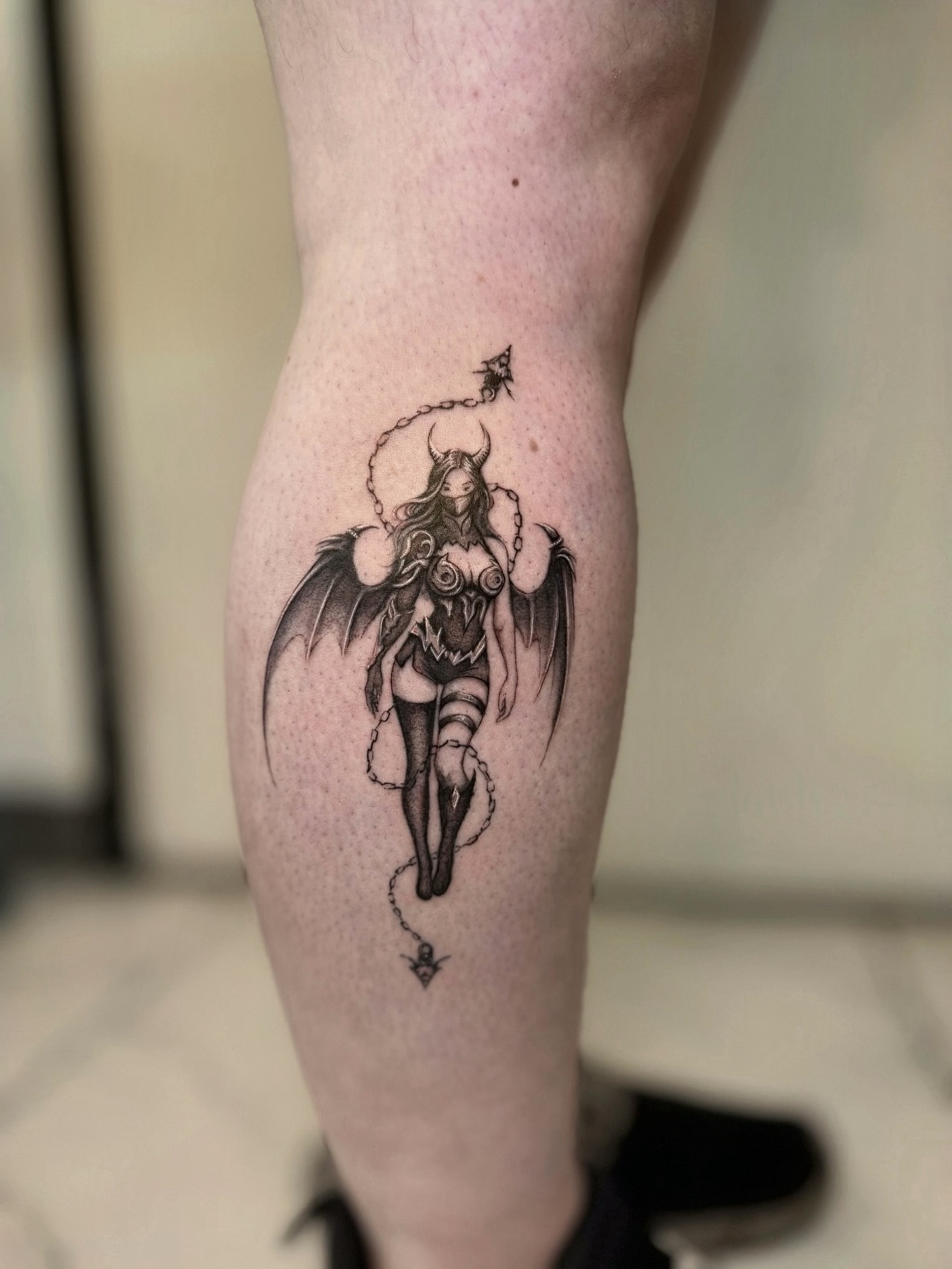 Winged female figure realism tattoo on the thigh by Miro Ink Tattoo