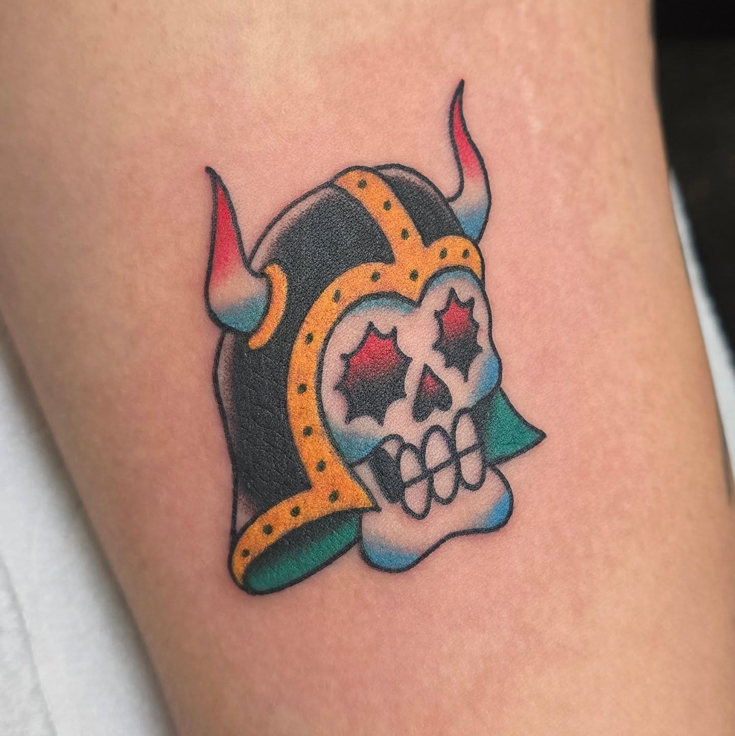 Viking skull American traditional tattoo on the thigh by A. Teixeira, Los Angeles, California
