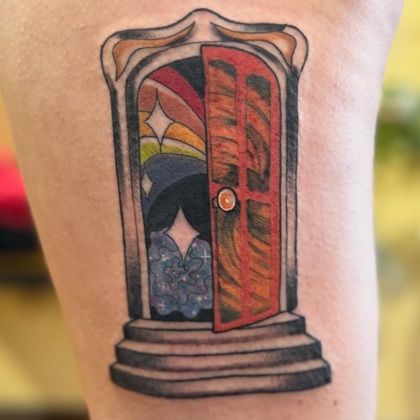 Doorway with celestial figure surrealism tattoo on the forearm by Erin McDavis