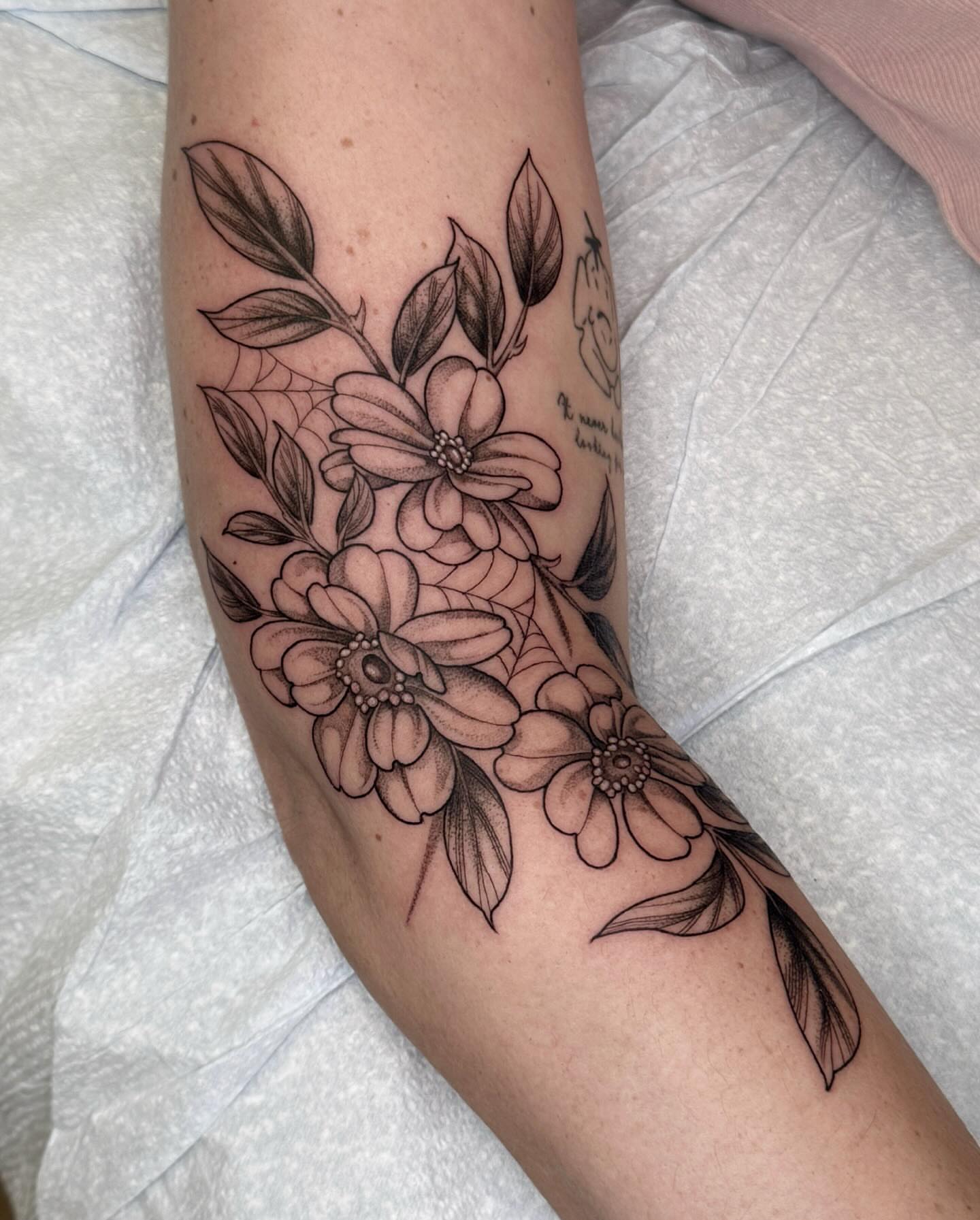 Flower bouquet black and grey tattoo on the forearm by 🌸delaney🌸