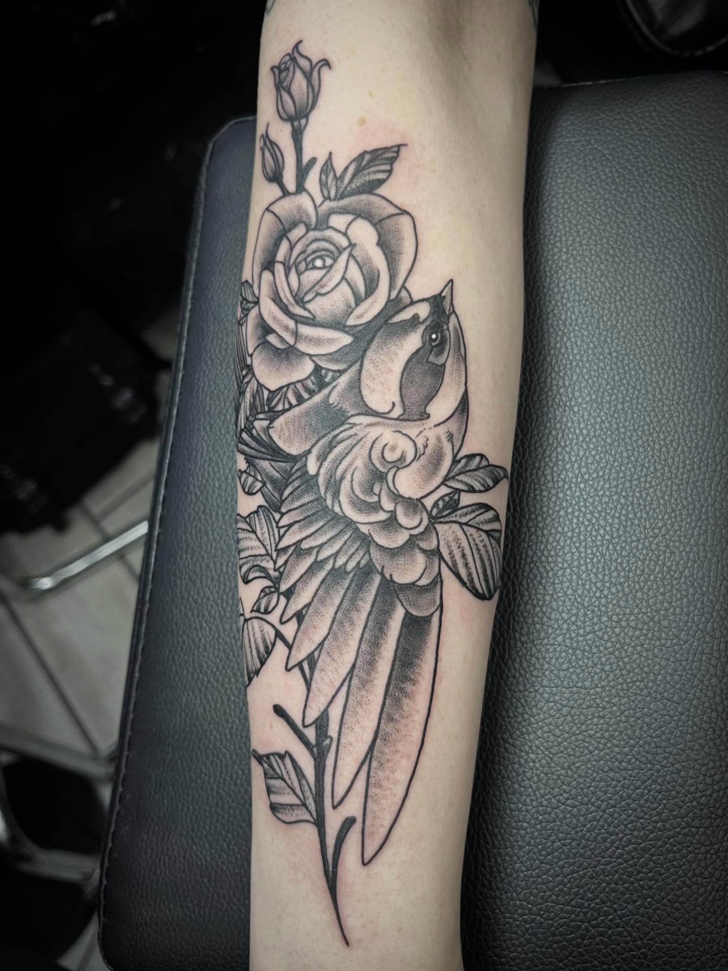 Rose and bird realism tattoo on the forearm by Sean Gallagher
