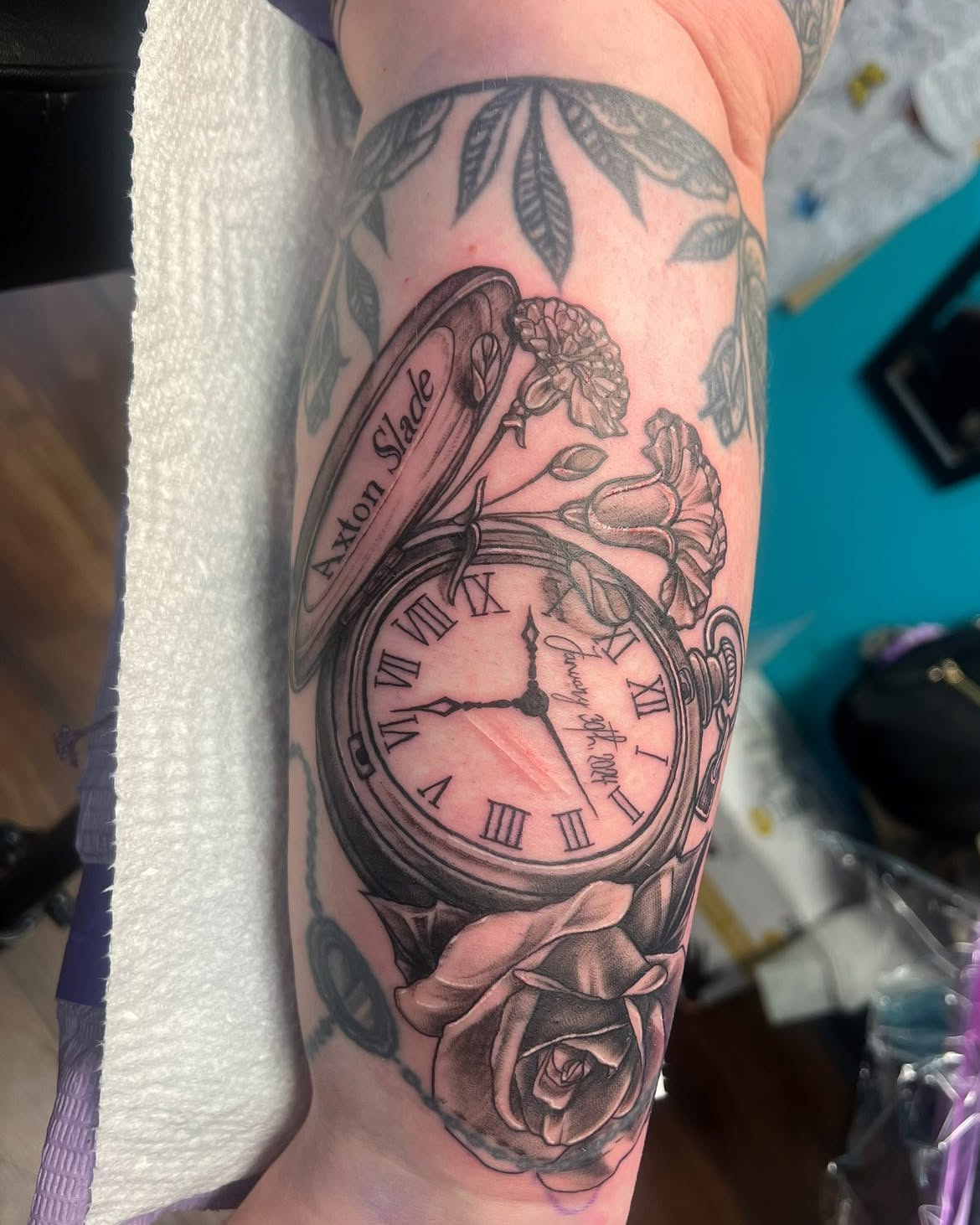 Pocket watch and roses realism tattoo on the forearm by Chelsea Nichole