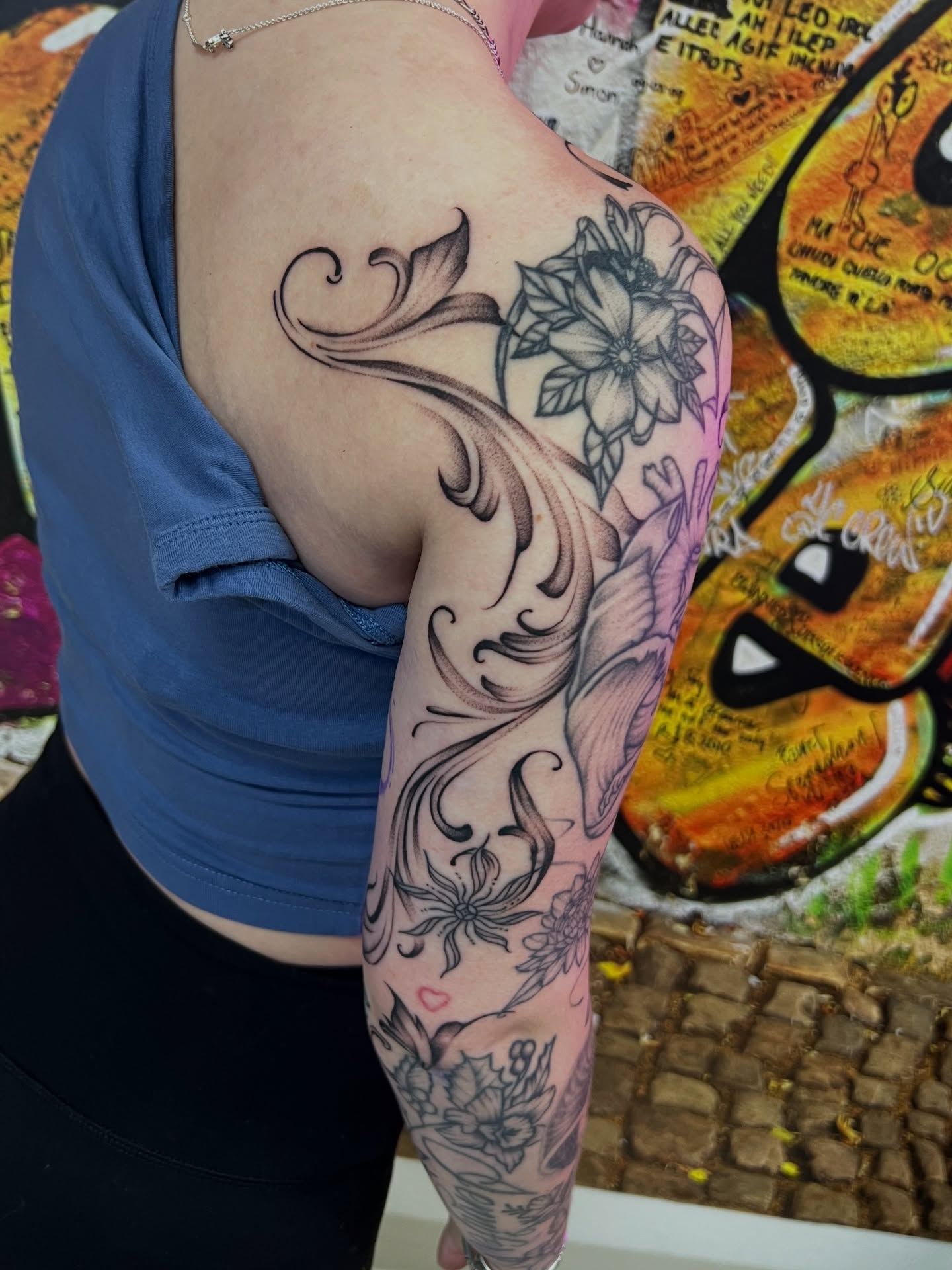 Floral design black and grey tattoo on the upper arm by Nadia ★