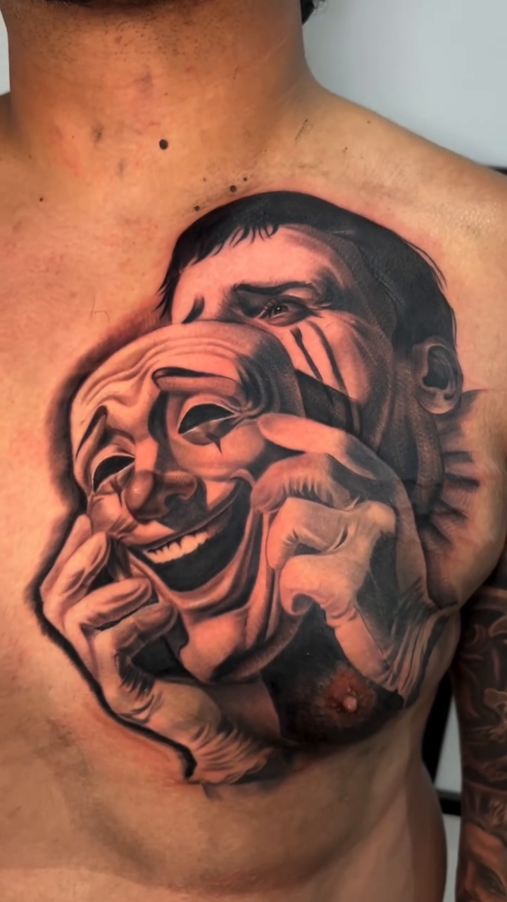 Comedy and tragedy masks realism tattoo by Isaac Barrientos