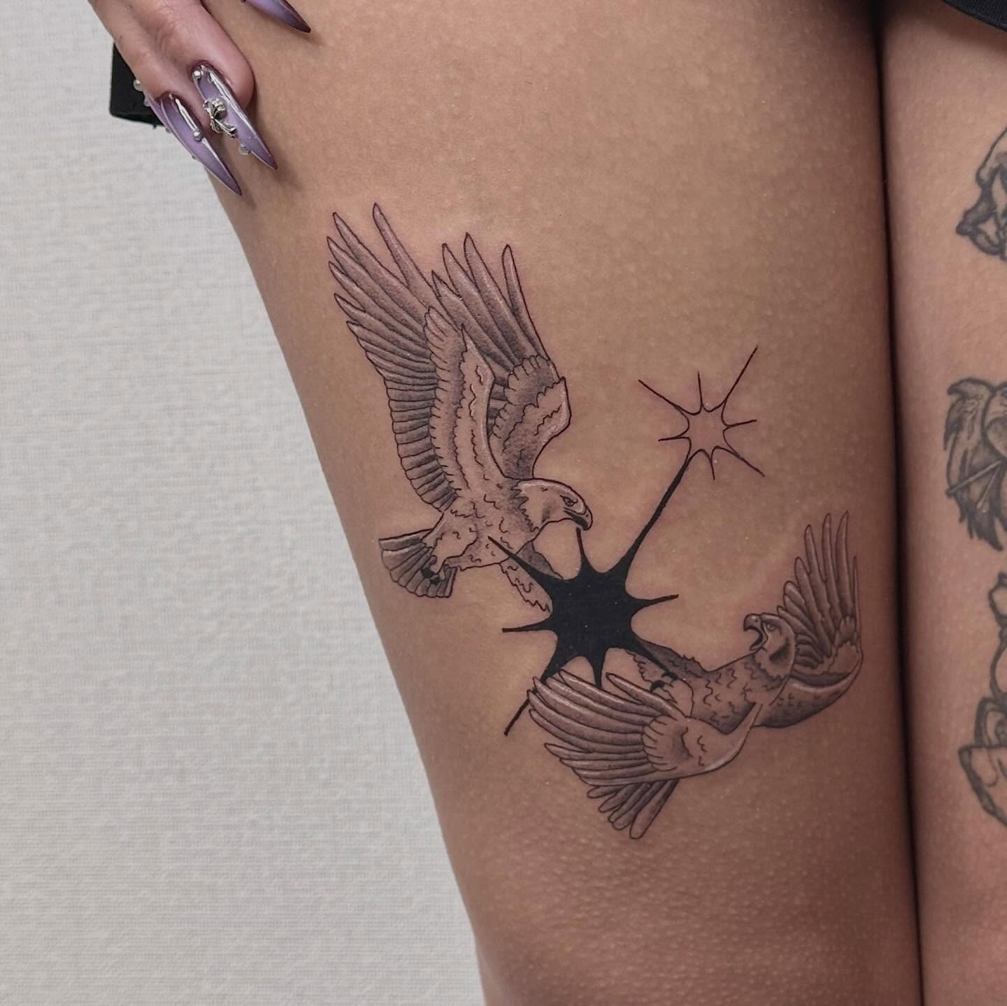 Birds and starburst black and grey tattoo on the thigh by Las Vegas Tattoo Artist