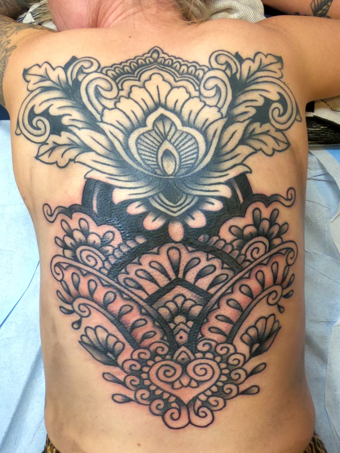 Lotus flower American traditional tattoo on the ribs by Cam TallBoy SLC Tattoo Artist, Salt Lake City, Utah