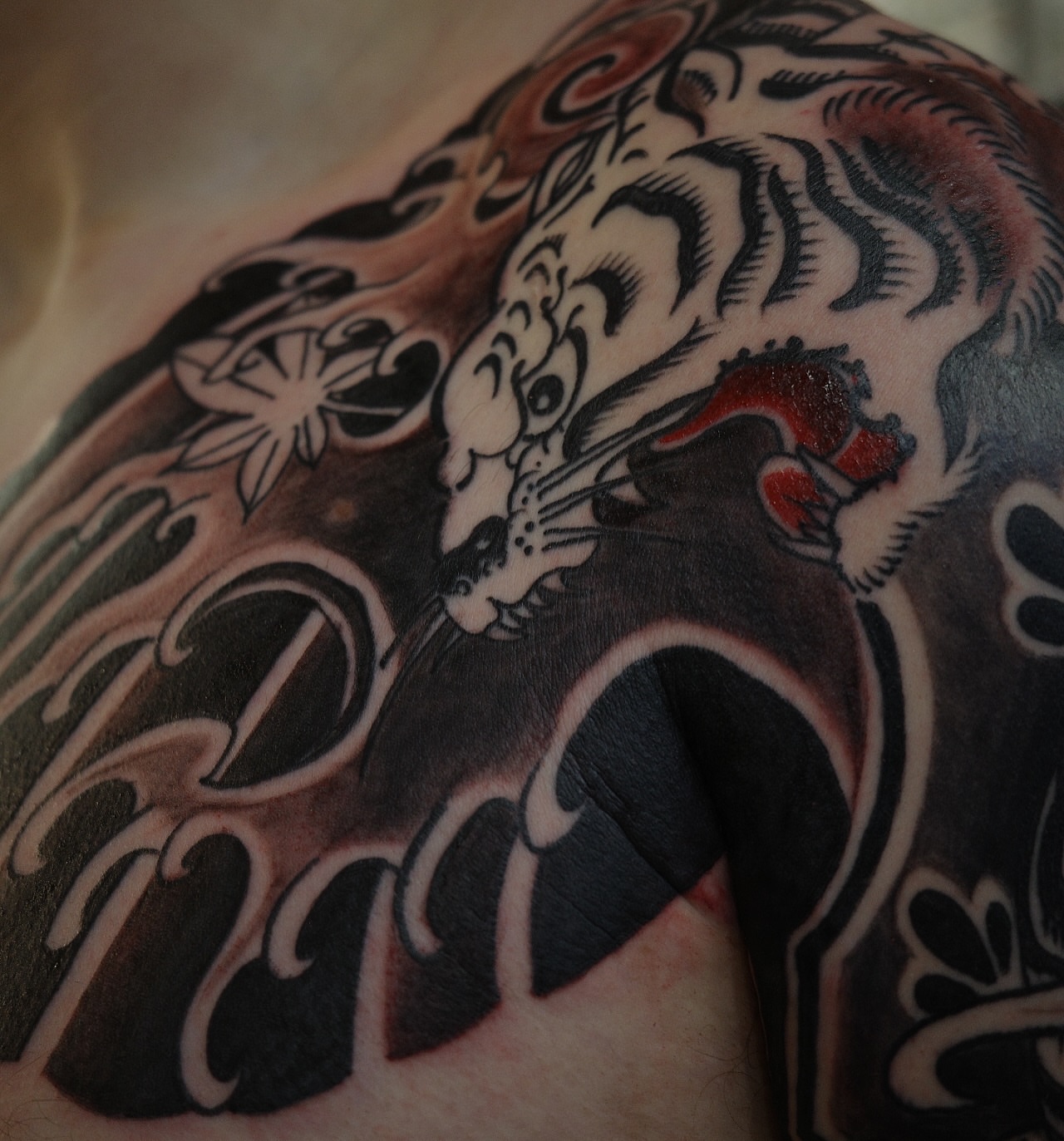 Tiger japanese irezumi tattoo on the shoulder by Innokenty Meshchakov, Portland, Oregon