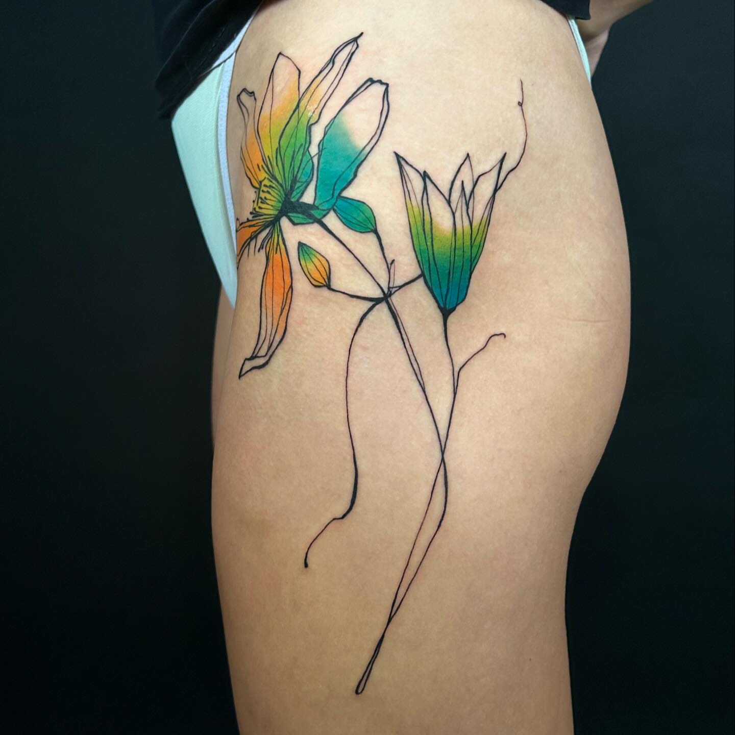 Abstract flowers minimalist tattoo on the thigh by @laurabochet_tattoo, Beacon, NY