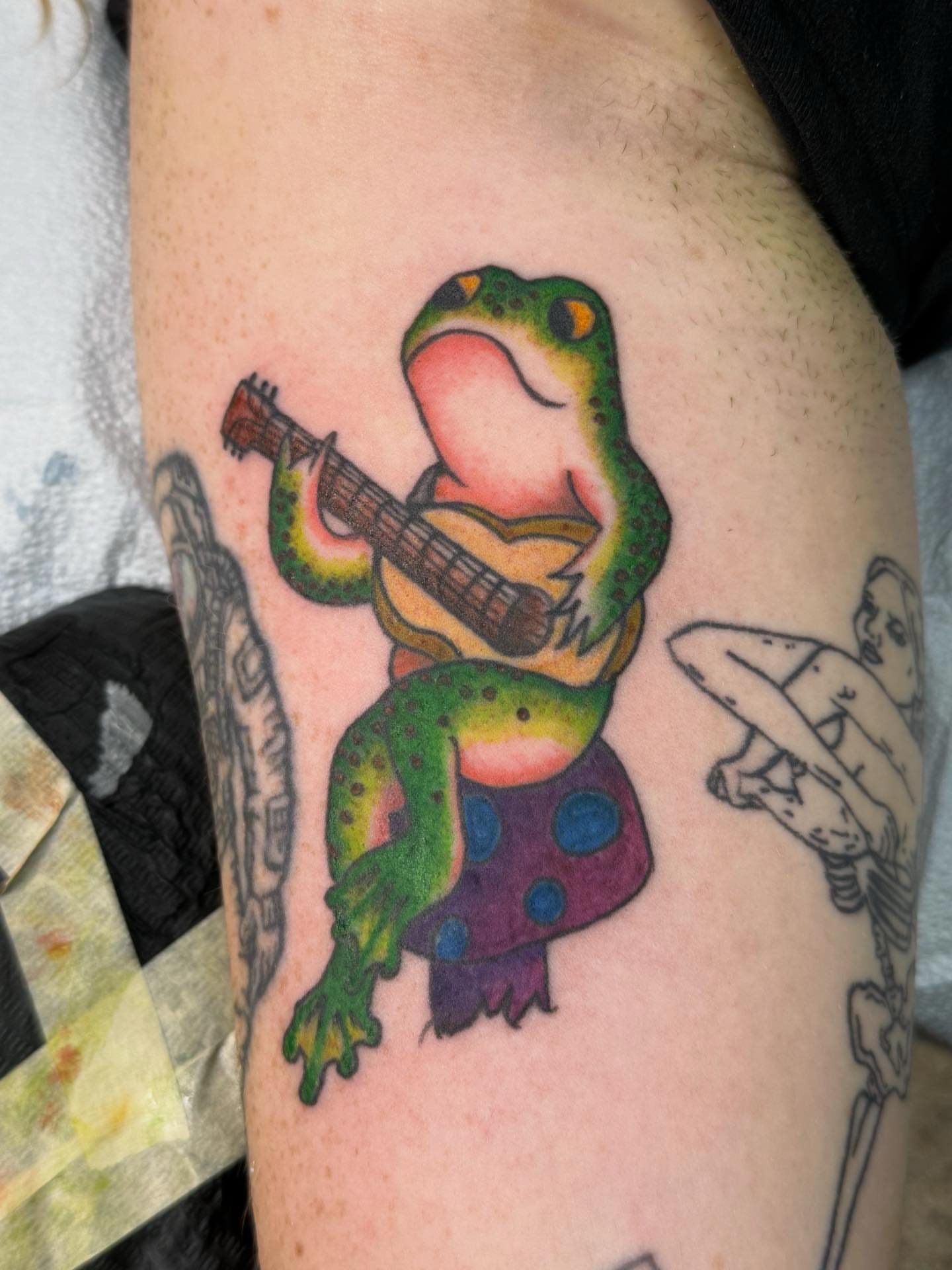 Frog playing guitar new school tattoo on the forearm by π΅ππππππ¦π€