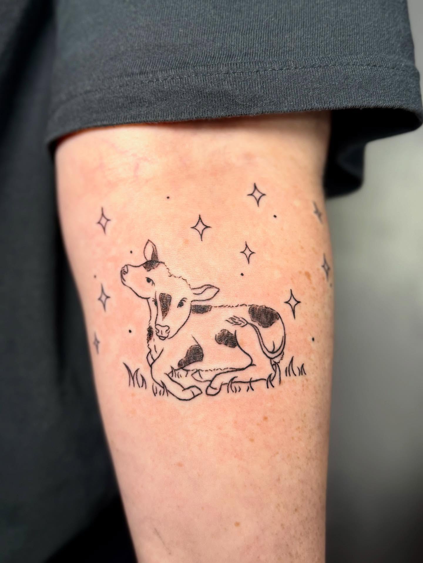 Cow and stars minimalist tattoo on the forearm by CharlieBoy