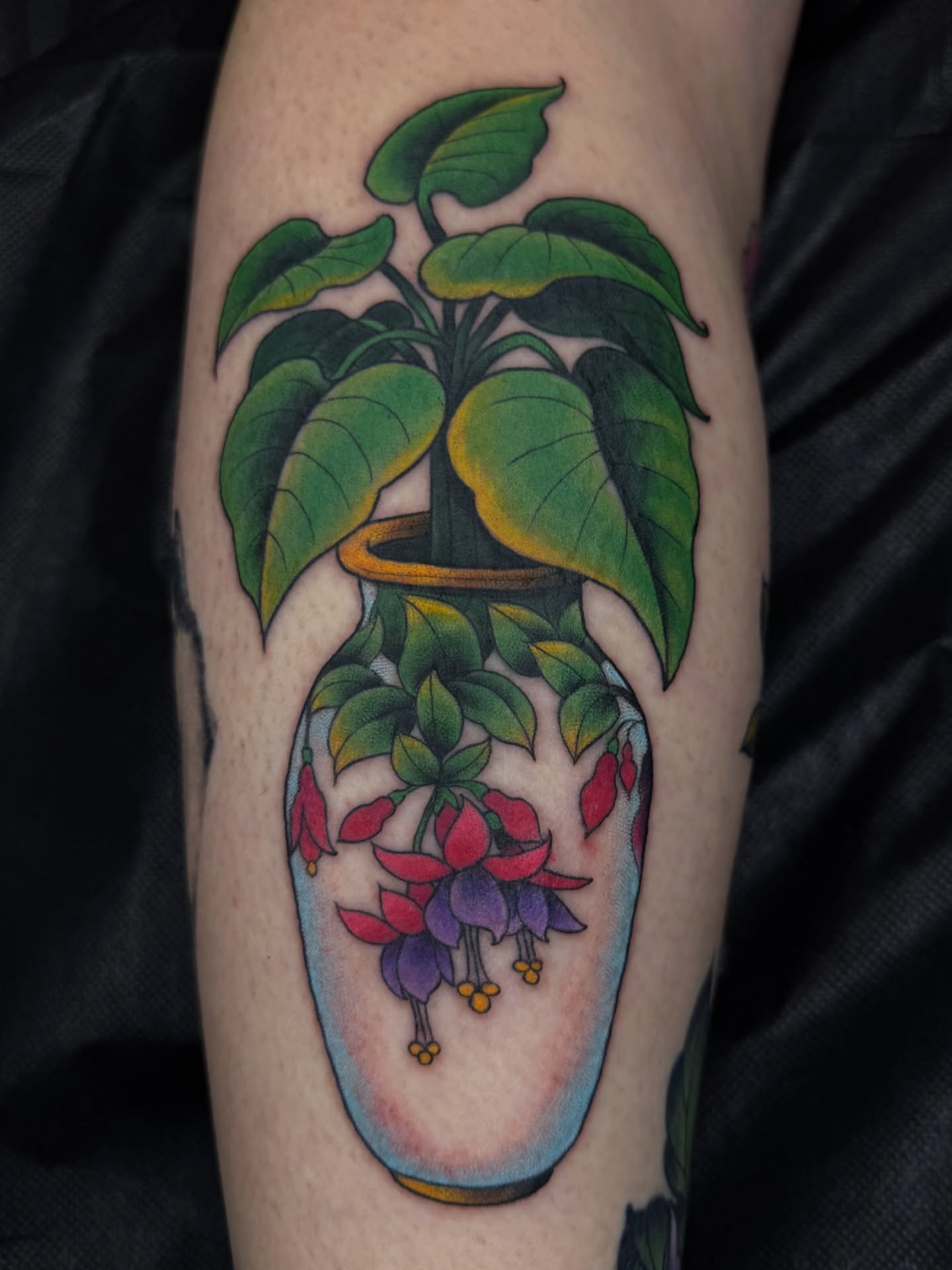 Fuchsia plant new school tattoo on the forearm by Anna Wall
