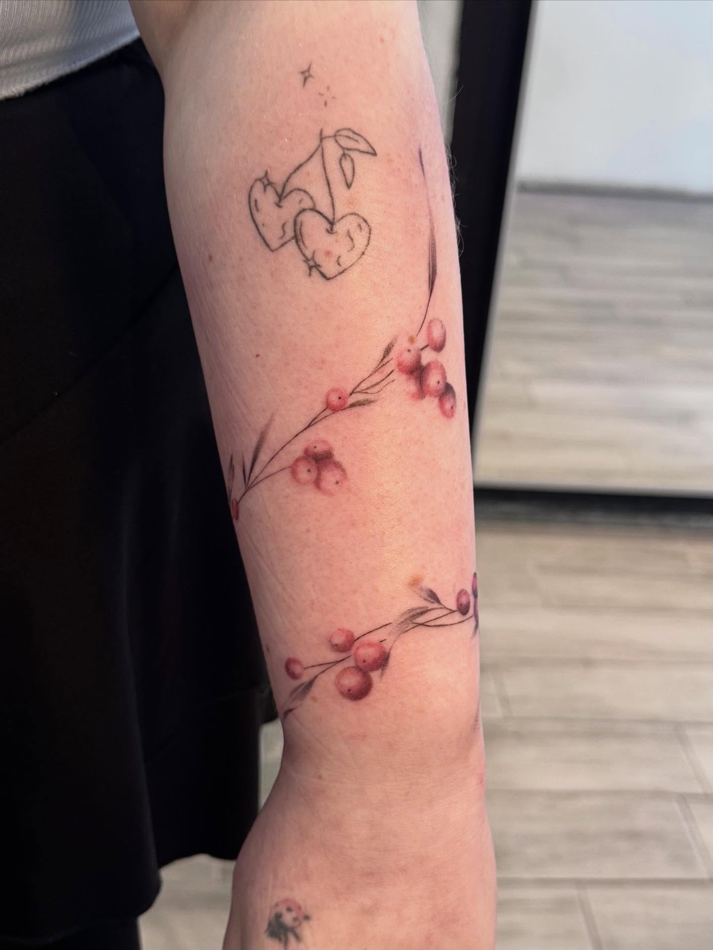 Cherries and berries dotwork tattoo on the forearm by Nat🫧