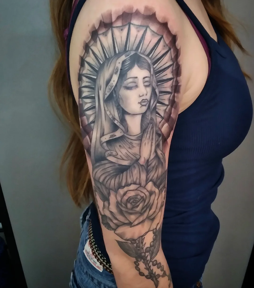 Religious figure praying realism tattoo on the forearm by Josh Sroga