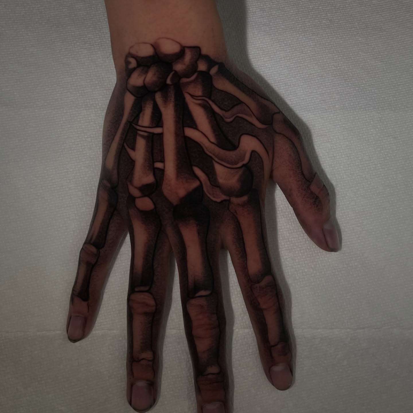 Skeleton hand black and grey tattoo on the hand by Jaylen - Atlanta Tattoo Artist