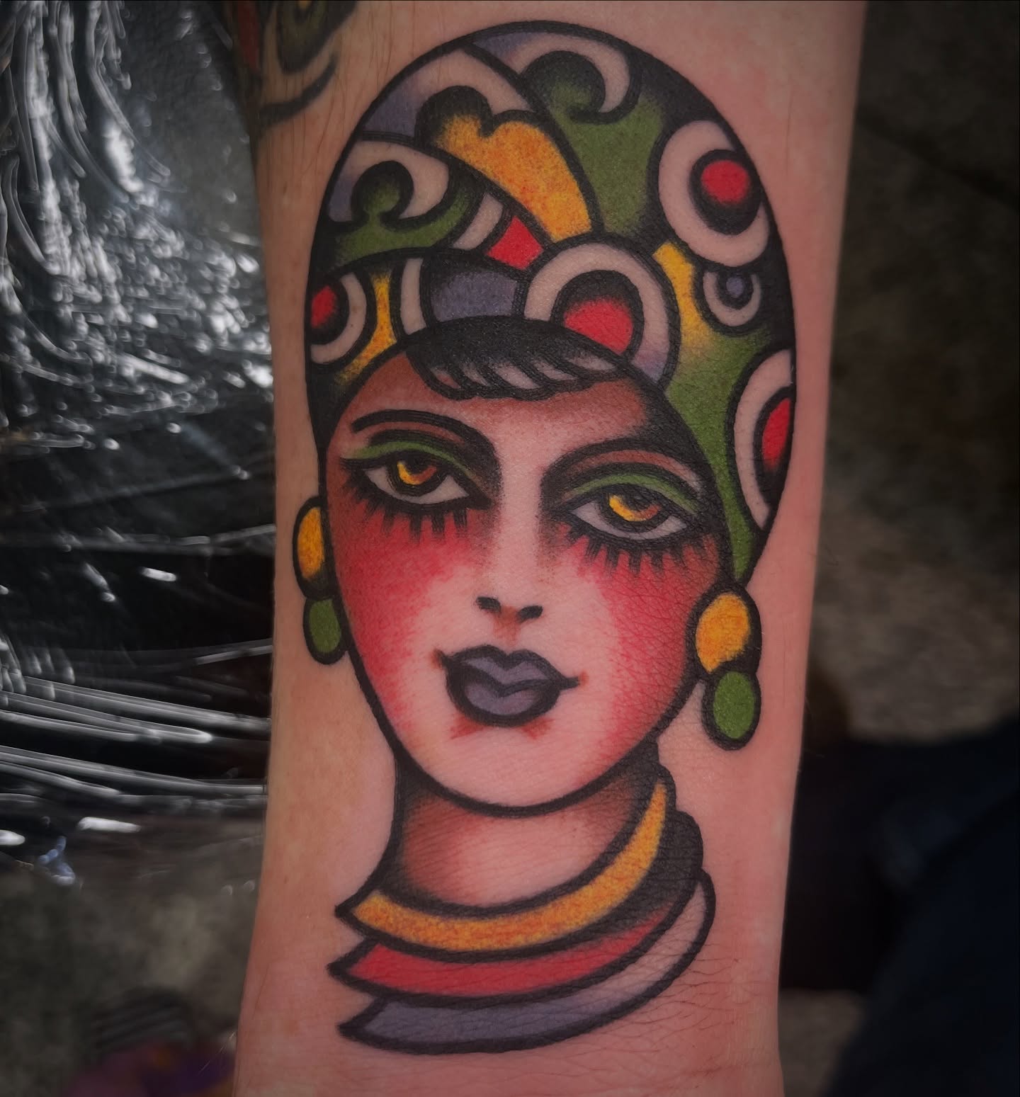 Woman's head American traditional tattoo on the forearm by Deya Aven, Nashville, Tennessee